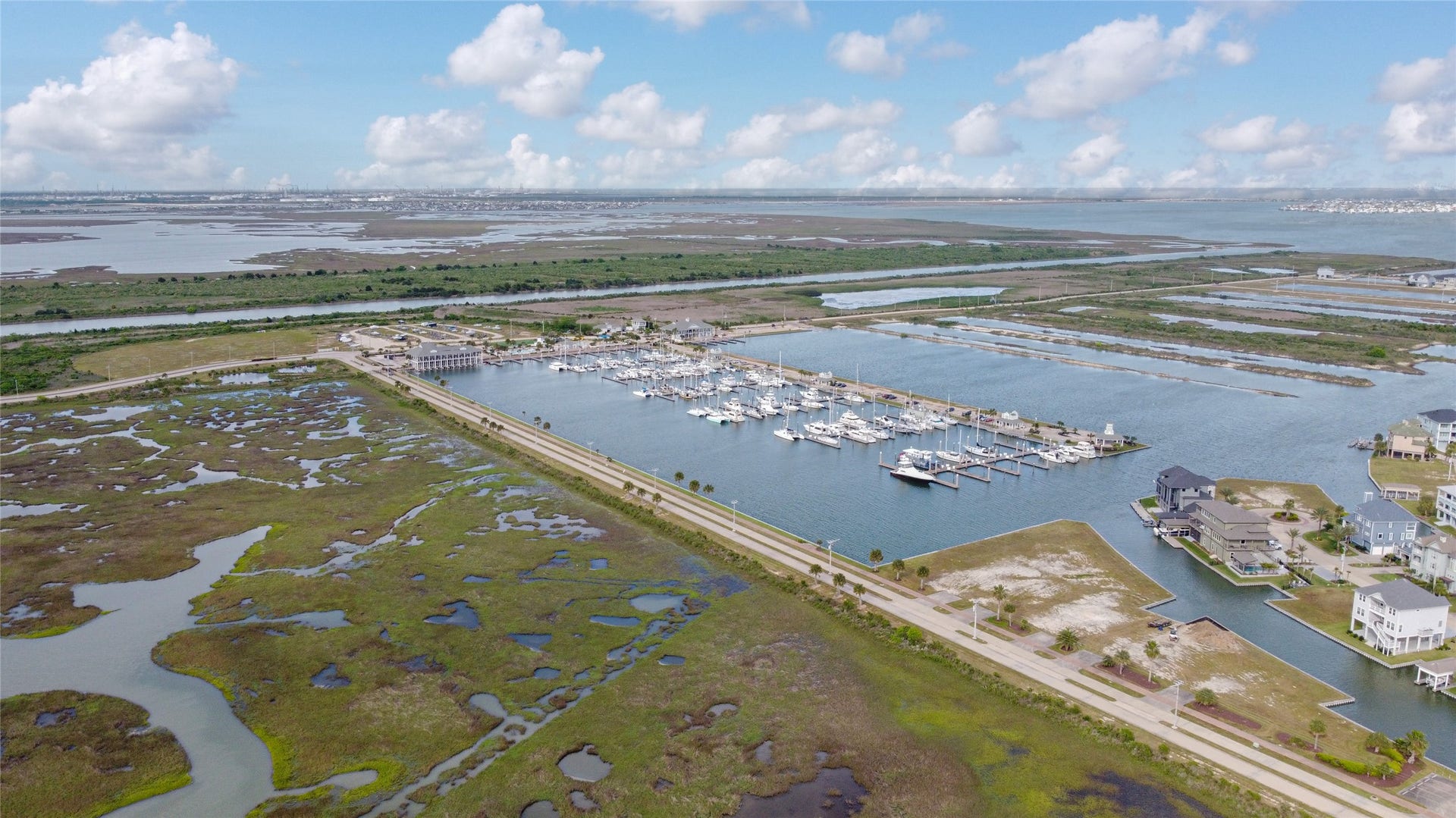 7 Big Torch, Hitchcock, TX 77563 The gated entrance to Harborwalks residential section is conveniently located alongside the marina, offering added privacy and a welcoming entry into the waterfront community.
