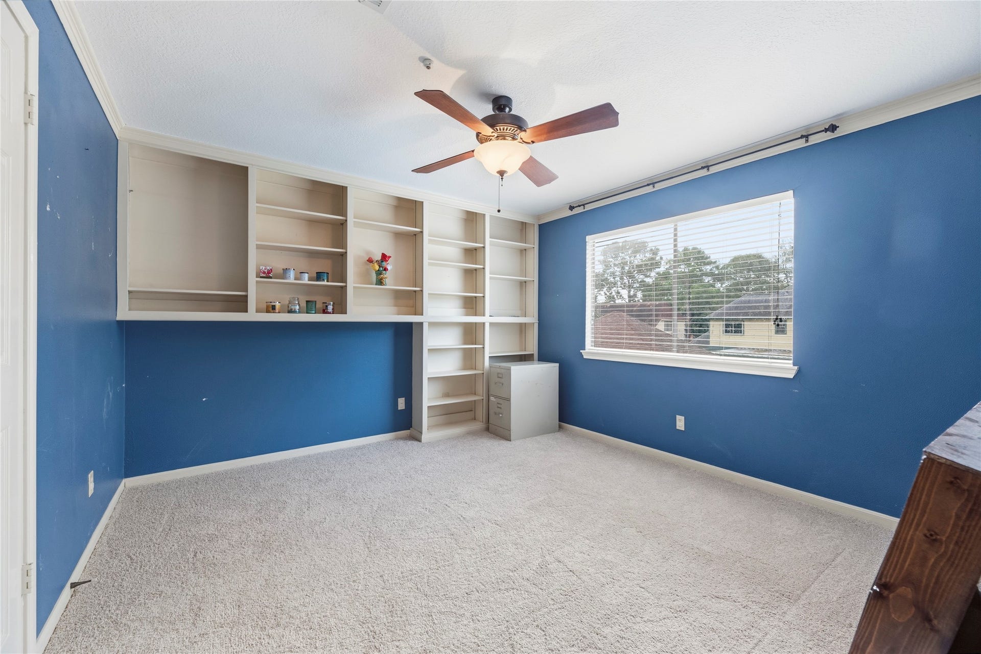 Secondary bedroom with built-ins.