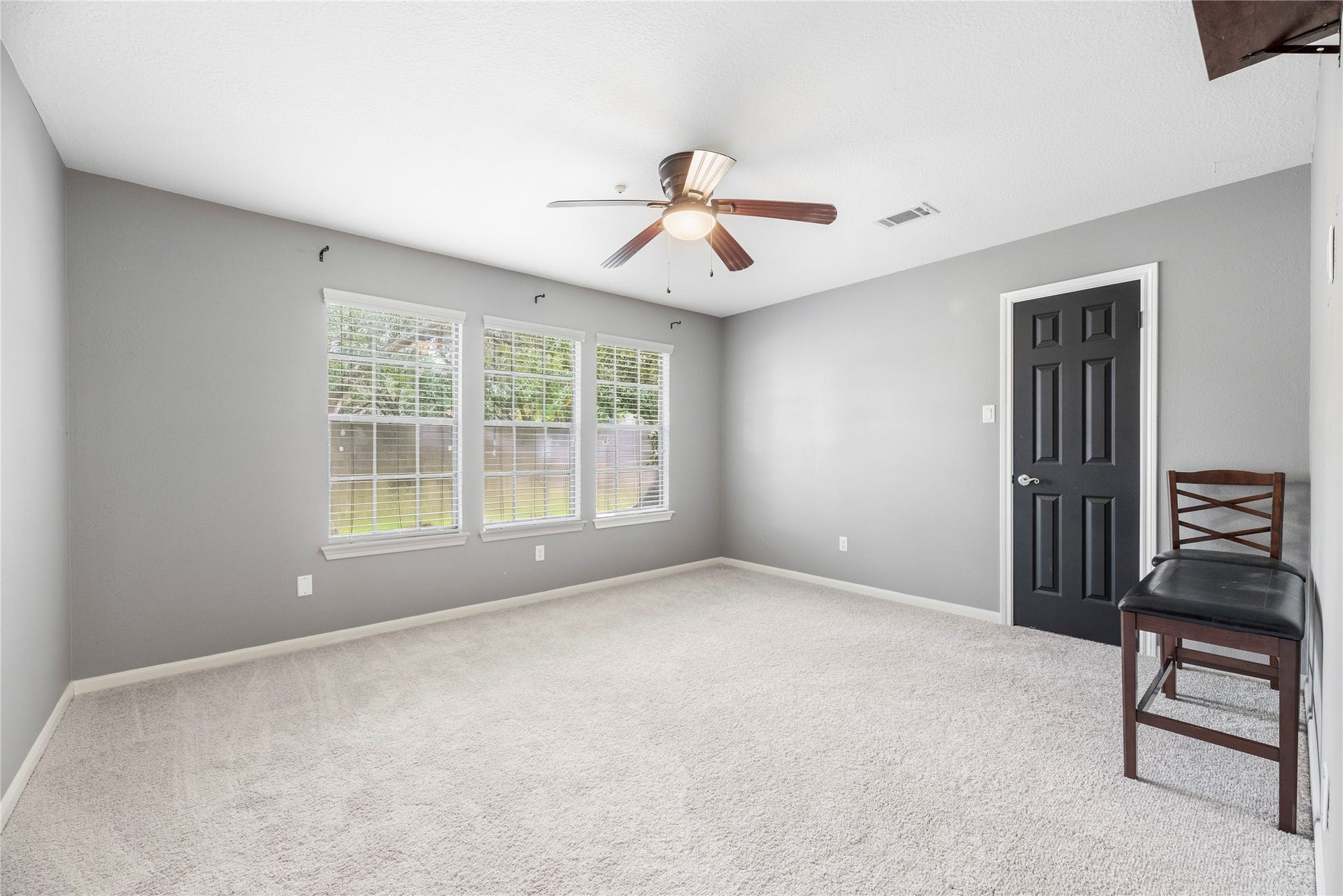 All upstairs secondary bedrooms feature ceiling fans, large closets and new carpet.