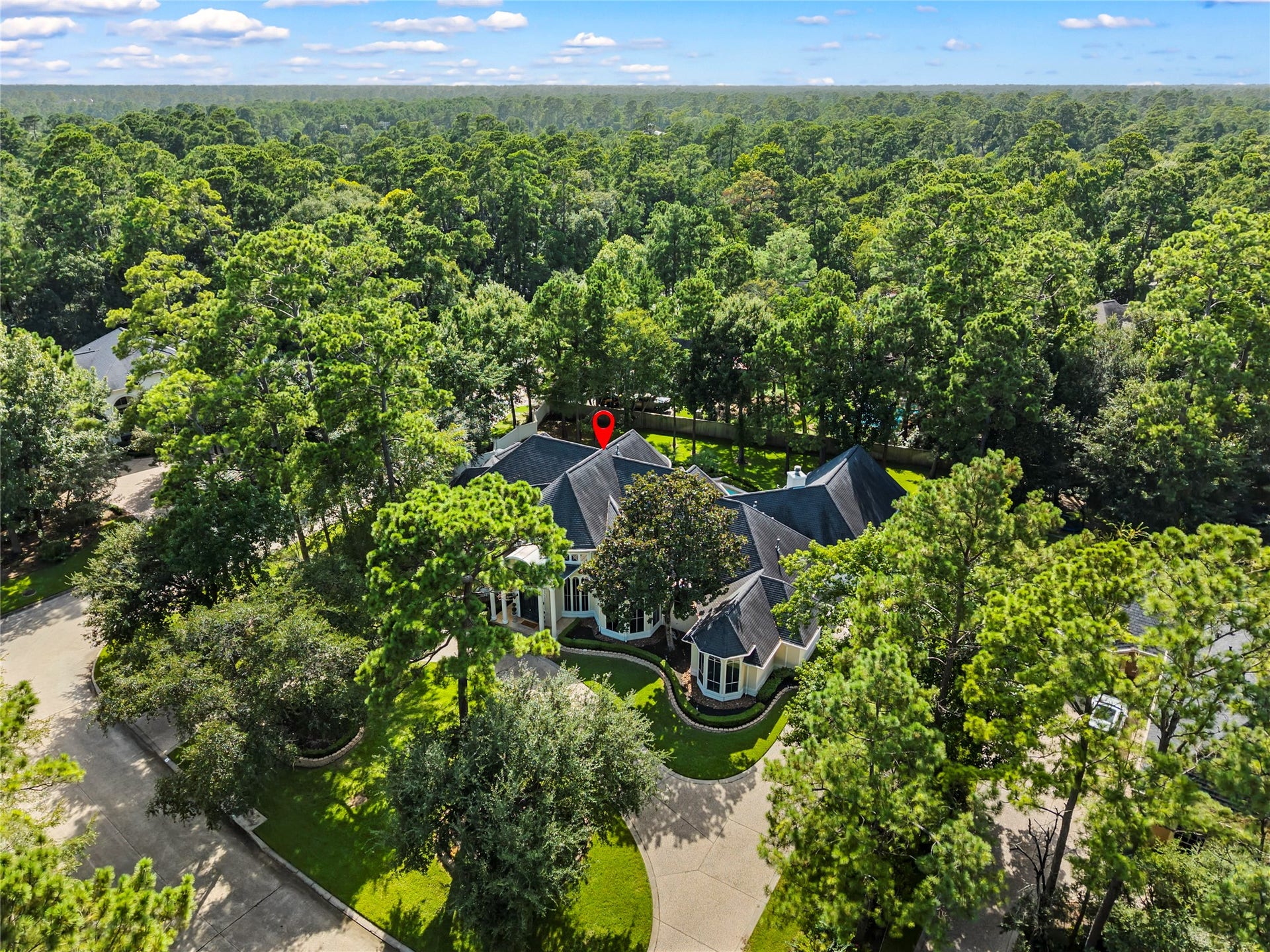 Highly sought after section of Benton Woods. Rare find almost 3/4 acre, corner lot, with extreme privacy! No flood zone!