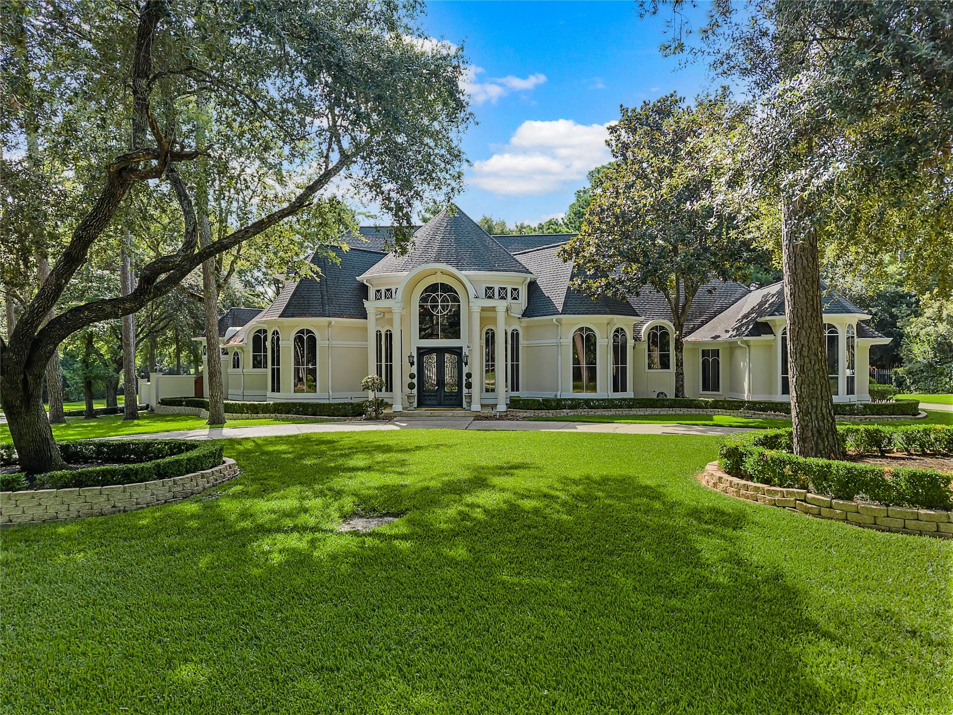 Stunning curb appeal with mature trees and landscaping. Corner lot with fully fenced backyard.