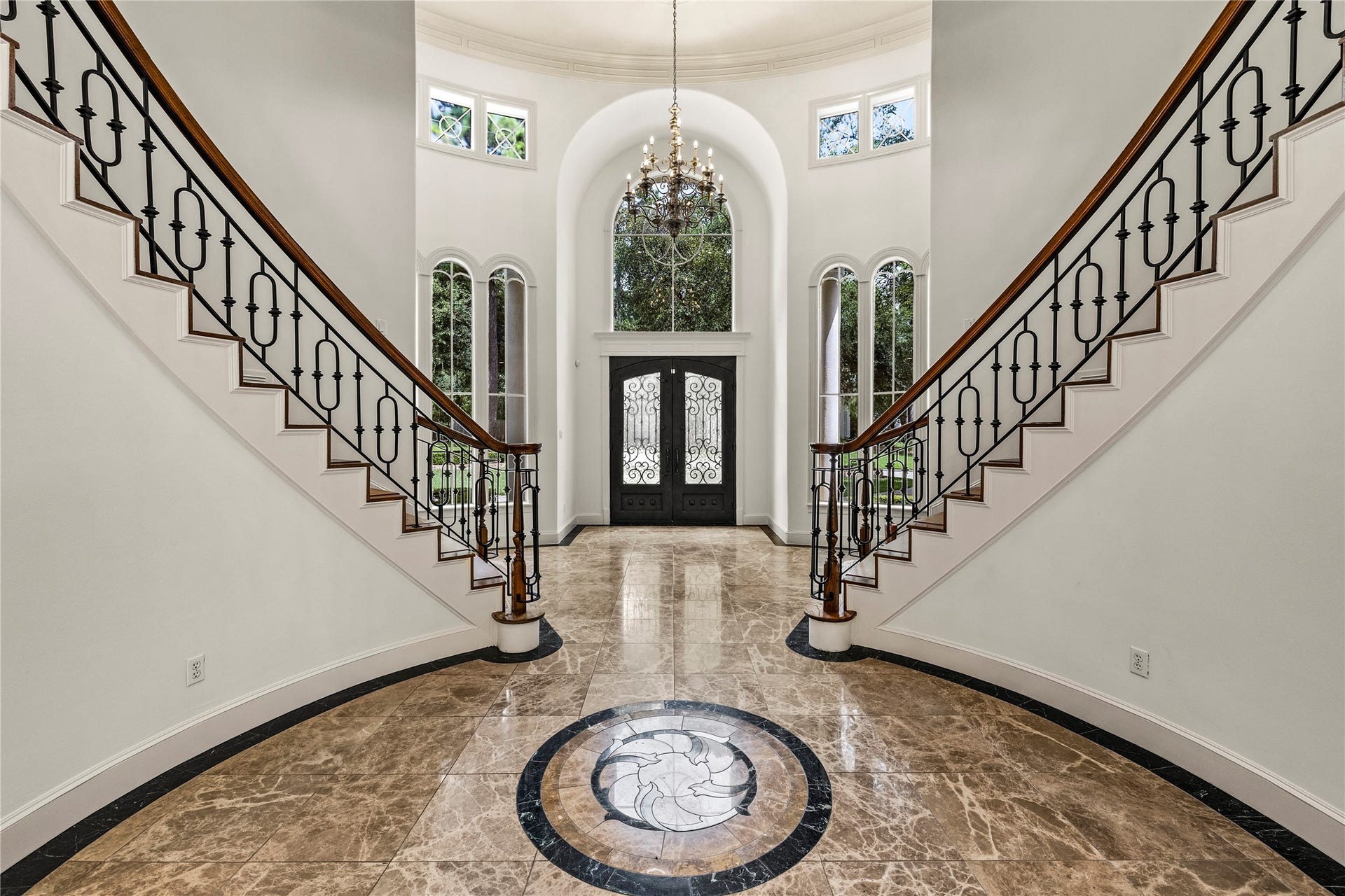 Beautiful windows adorn the entry way allowing natural light into the front of the home.