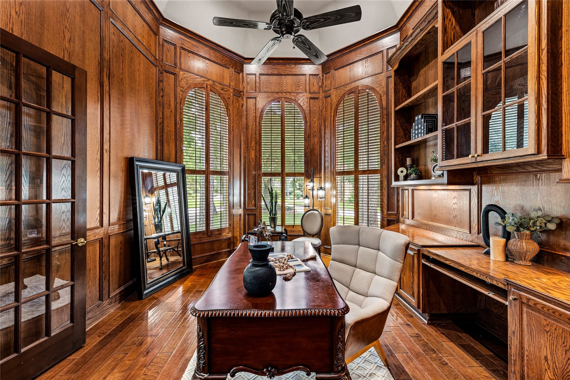 Custom woodwork throughout, floor to ceiling windows, and built-in cabinet - all show stoppers!