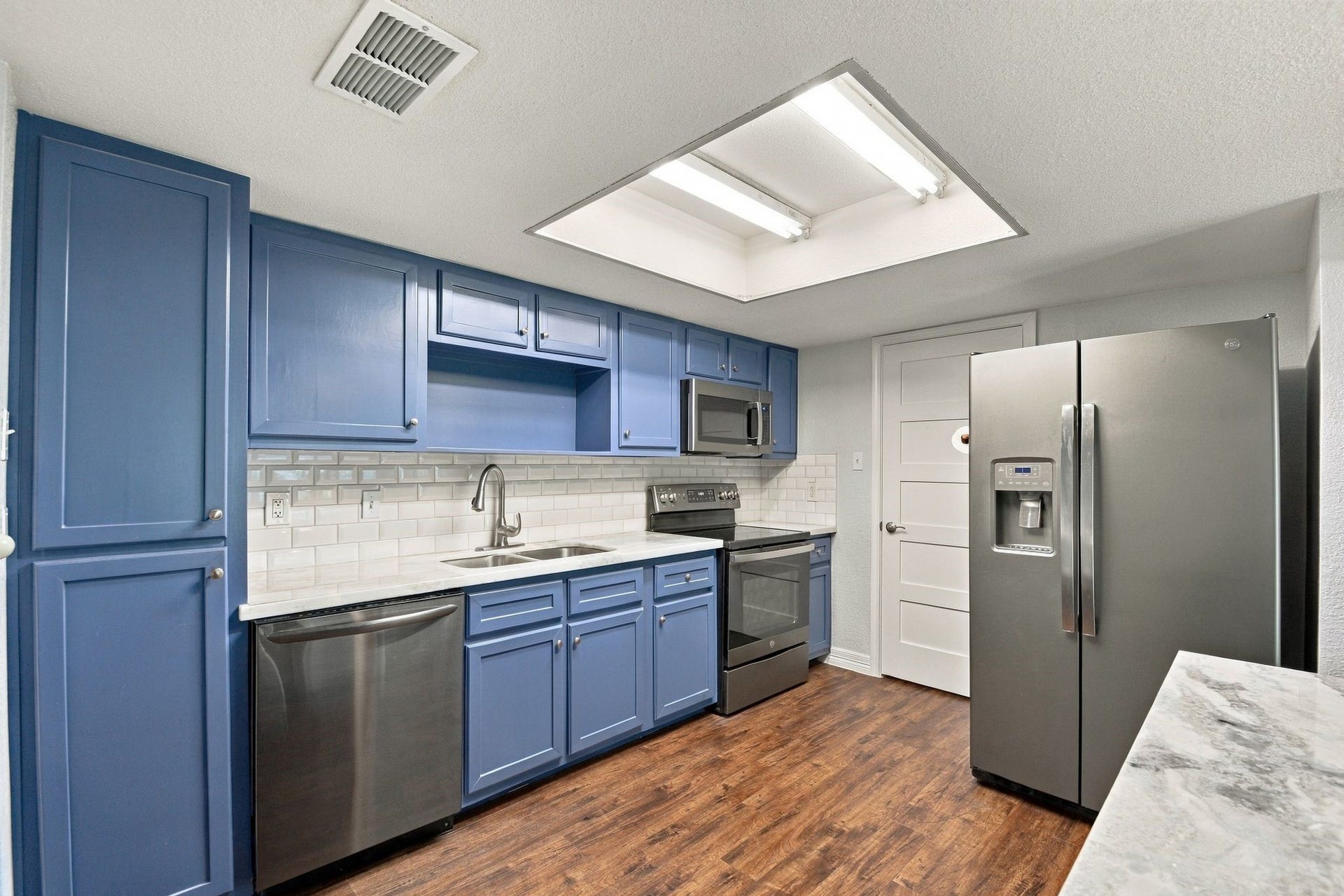 14777 Wunderlich Drive, #413, Houston, TX 77069 Lots of extra storage with the extra built in pantry next to the dishwasher and center island storage that was added. There is also a walk in Pantry across from the utility area closet off of the Kitchen.