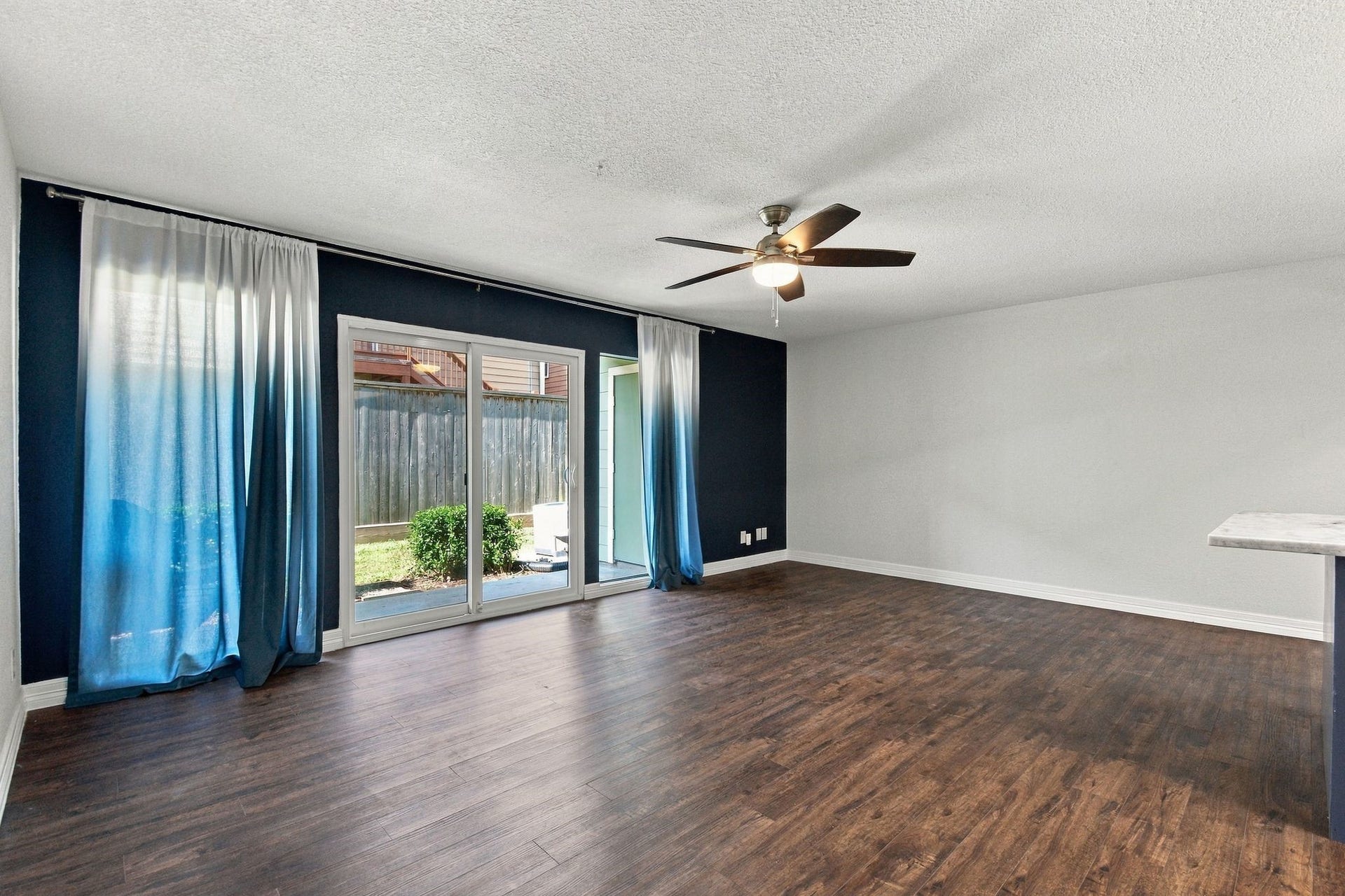14777 Wunderlich Drive, #413, Houston, TX 77069 Beautiful wall of windows and easy access to your private covered patio.