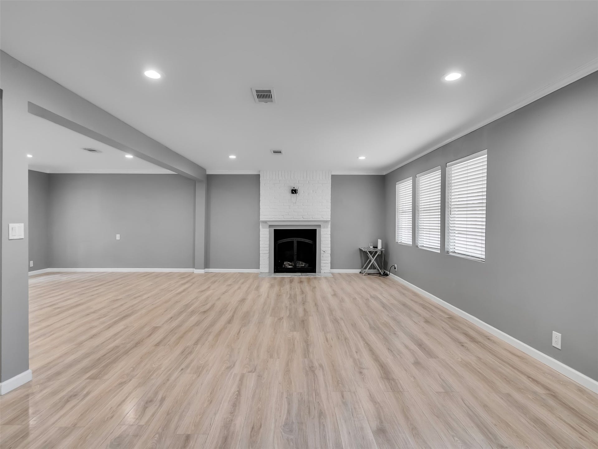 No need to split your entertaining area.  There is plenty of room to have a TV area and even a family game night area downstairs.