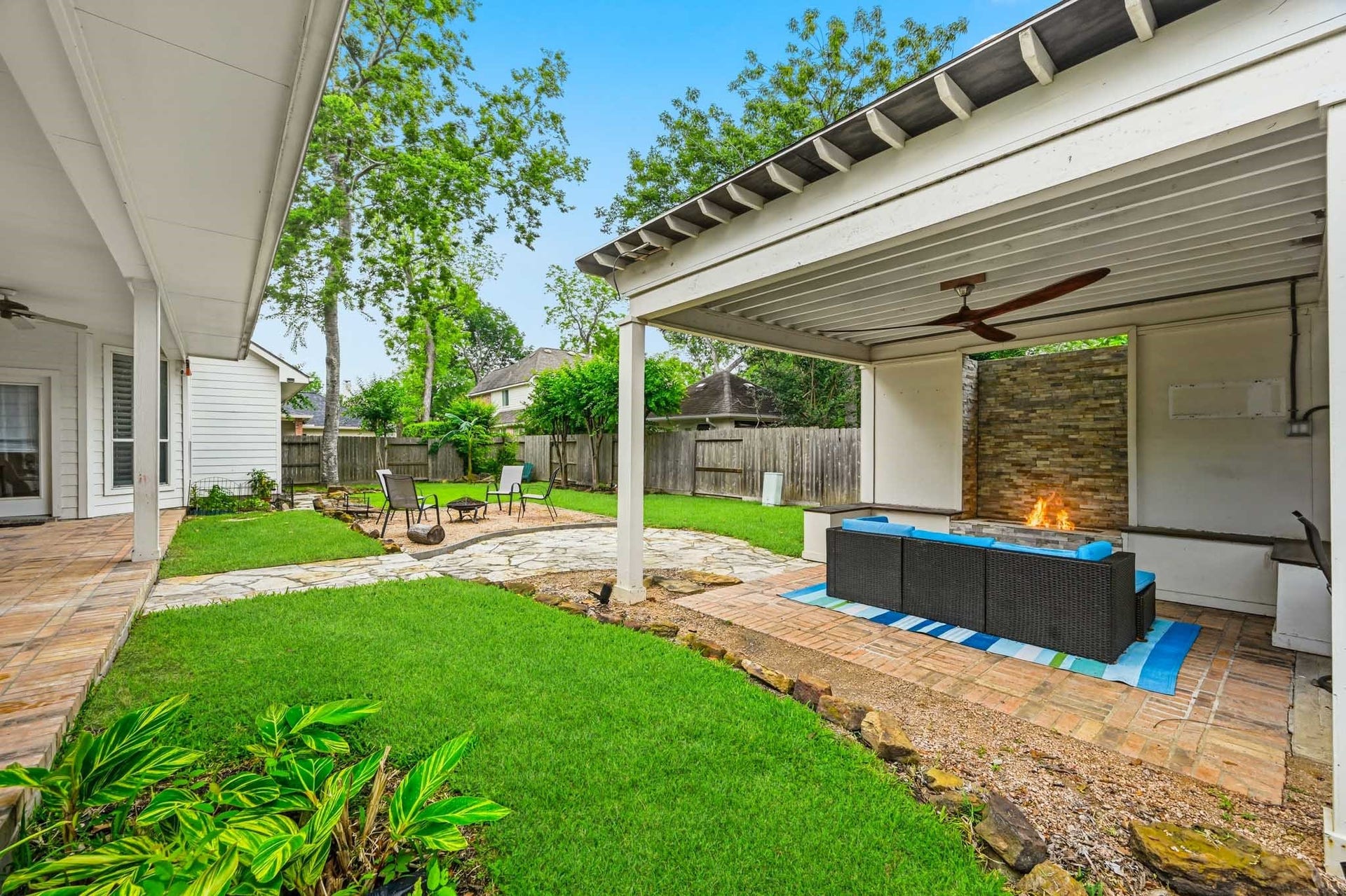 3807 Oakland Circle, Missouri City, TX 77459 Fabulous backyard space with extended covered patio + additional covered patio with built-in fireplace
