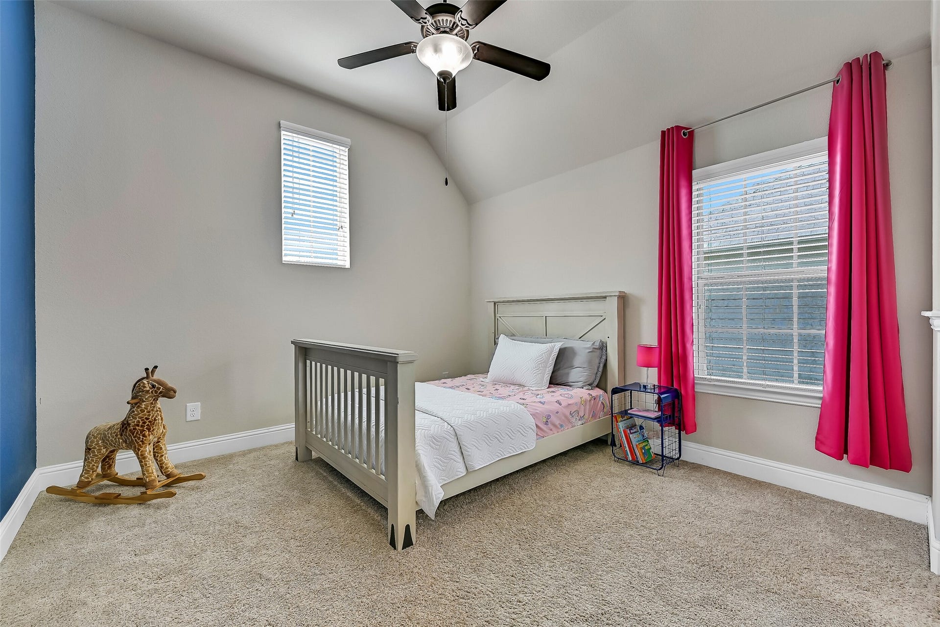 1645 Longwood Glen Lane, Friendswood, TX 77546 One of two spacious bedrooms connected by a Jack-and-Jill bath, this inviting room features plush carpeting, a vaulted ceiling, a lighted ceiling fan, and windows that fill the space with natural light. A step-in closet provides plenty of everyday storage.