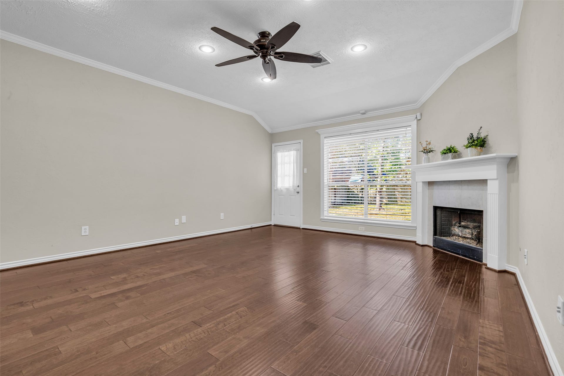 14 Almond Branch Place, The Woodlands, TX 77382 Exterior door leads to a large backyard. Notice the beautiful crown molding.