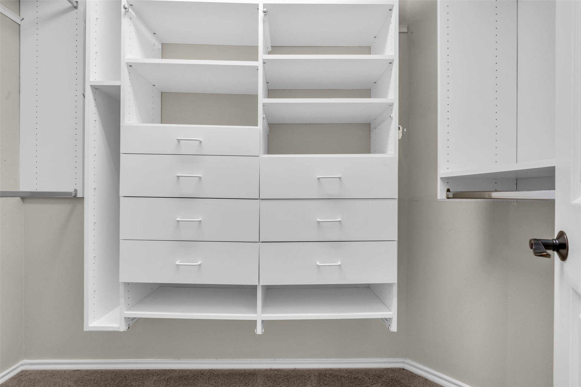14 Almond Branch Place, The Woodlands, TX 77382 Primary suite custom closet. Its larger than shown here.