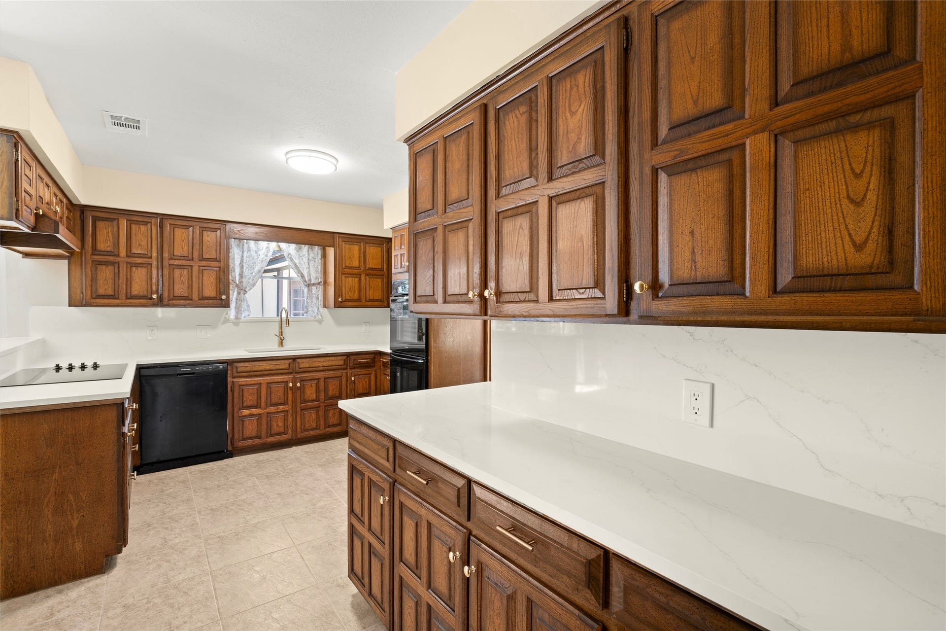 Quartz countertops have been added with a seamless backsplash.