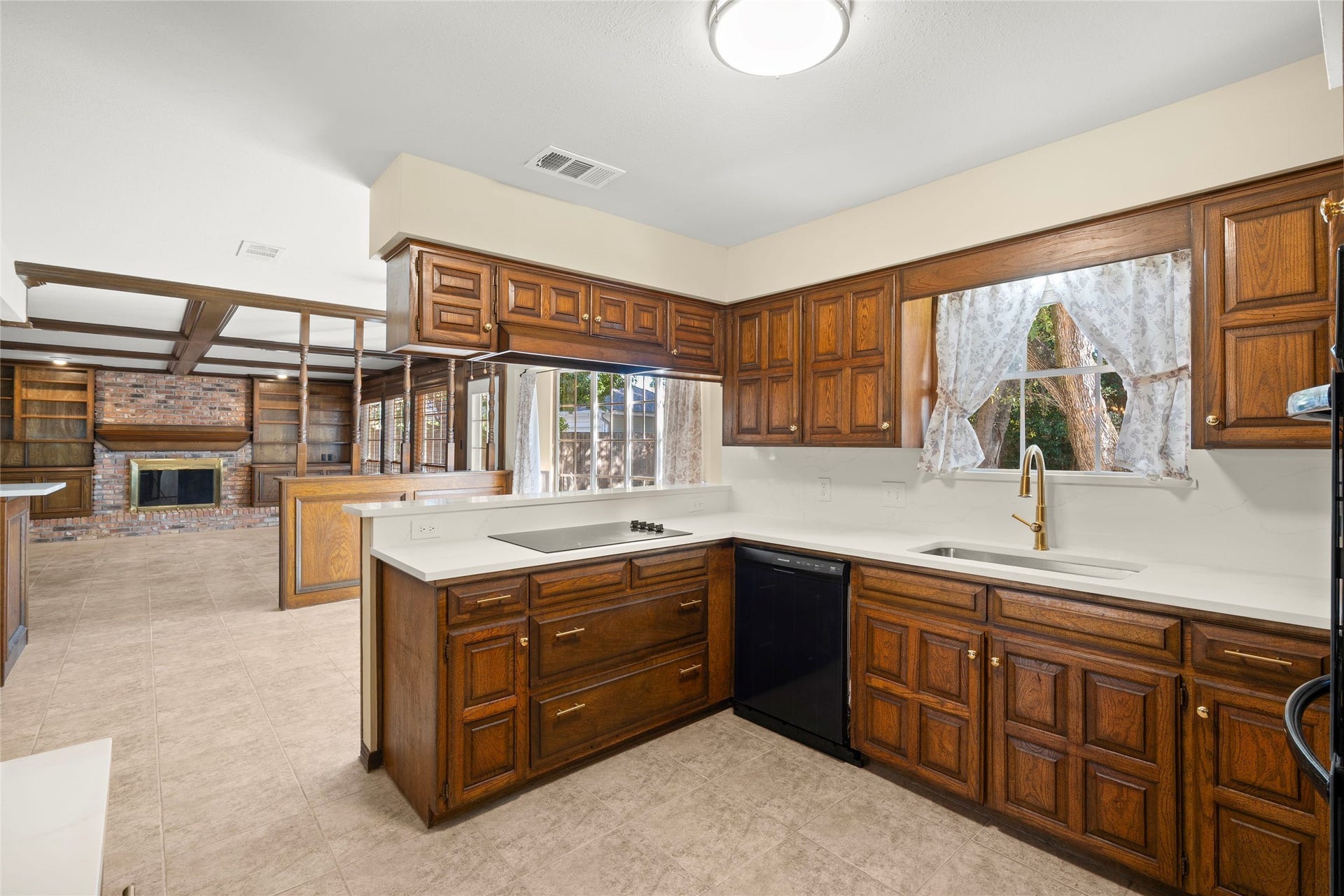 Although from a different generation the kitchen is open to the breakfast room and family room.