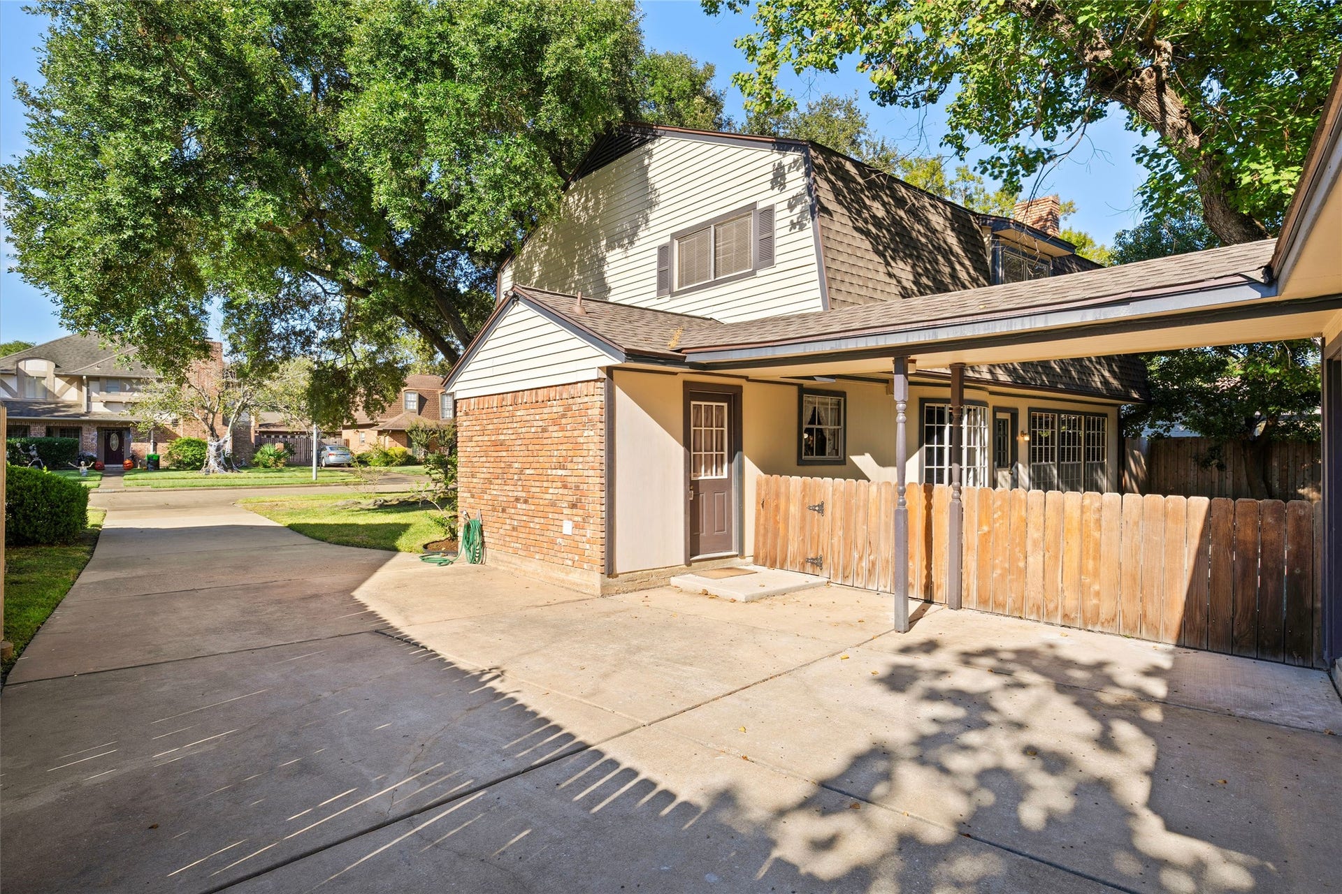 The driveway by the garage has extra space for two cars.