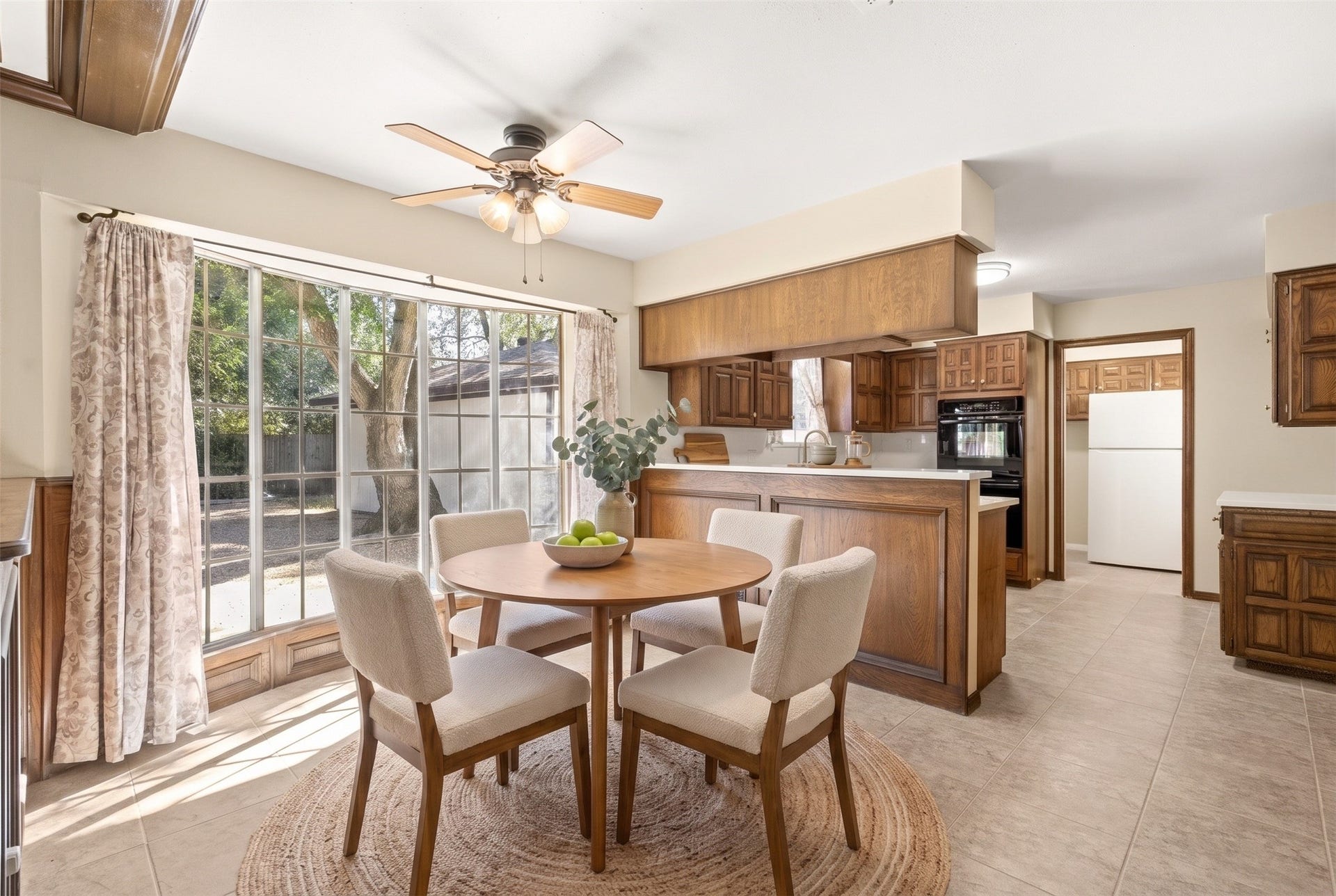 Sunshine filled breakfast nook virtually staged.