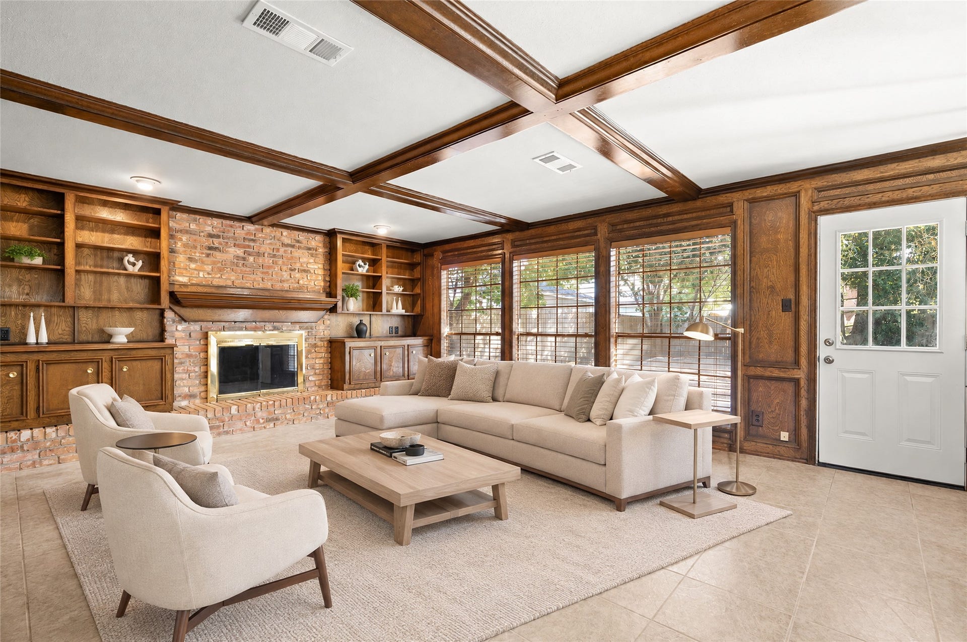 The family room is virtually staged to show options for arranging your personal space.