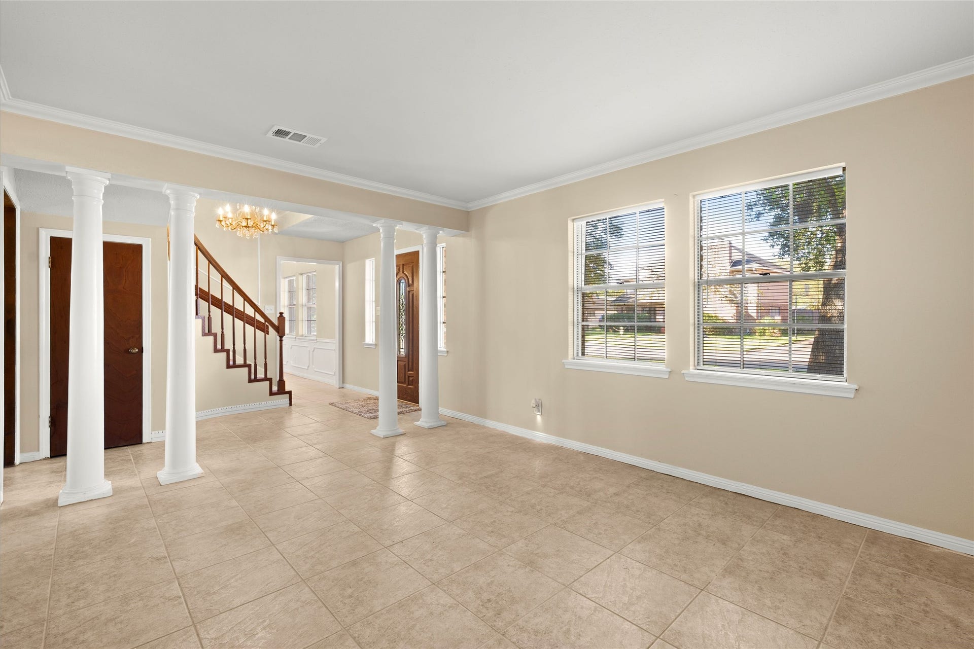 Enjoy natural light that pours into the home. This is a view of the den, could be an office, or any flex room.