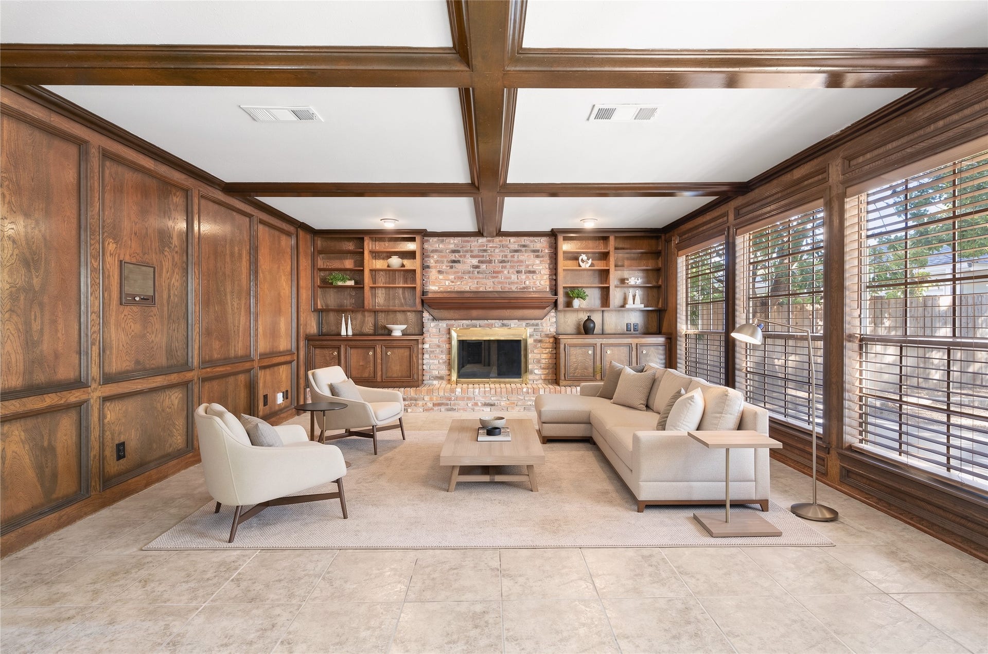 The family room is virtually staged to show the ample space providing room for larger furniture and furnishings.