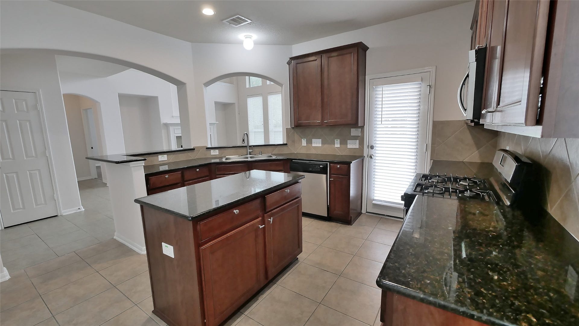 1906 Lauralwick Court, Katy, TX 77484 Kitchen looking into Family Room