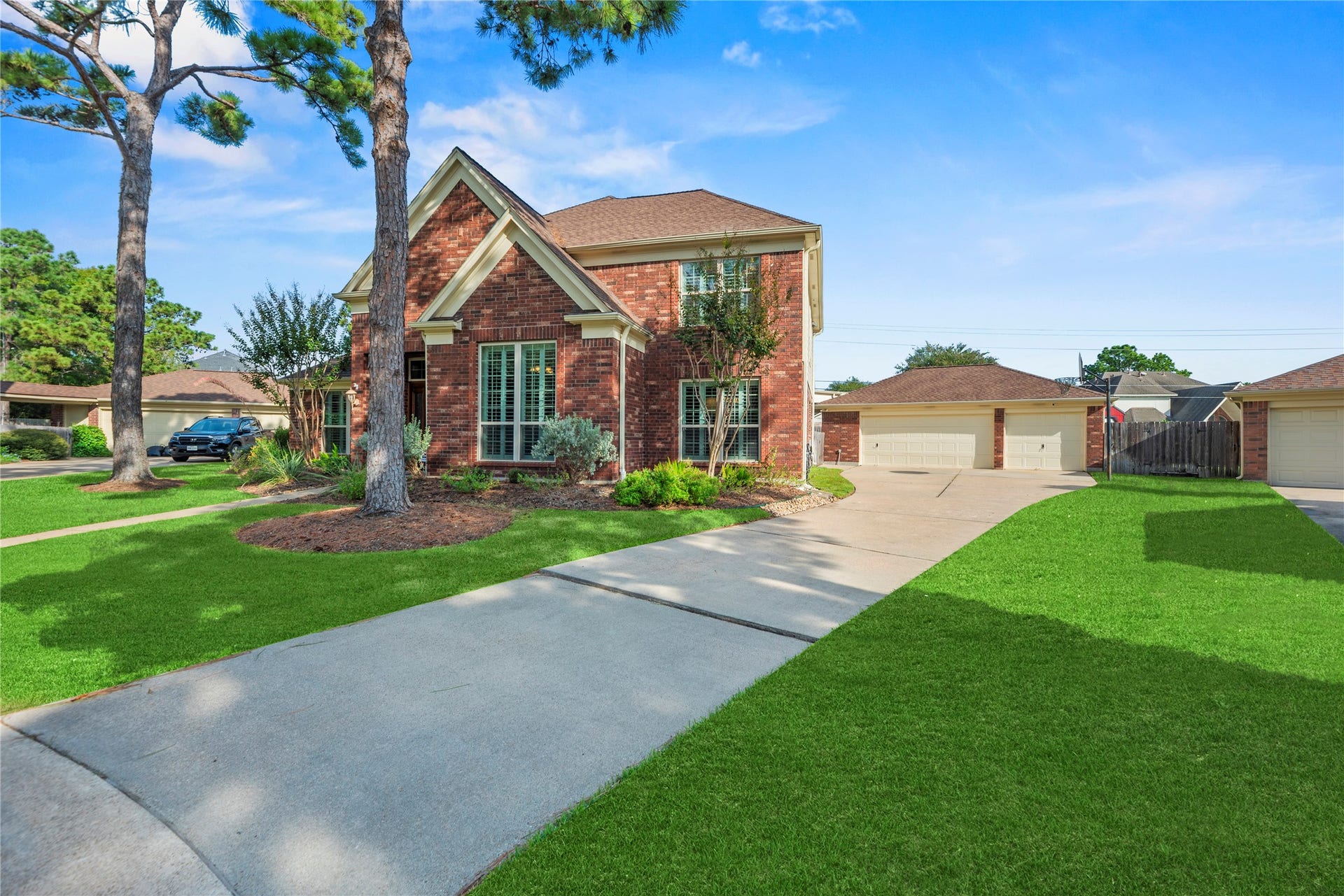 17906 Lone River Court, Houston, TX 77095 3-car detached garage and long driveway provide plenty of parking.