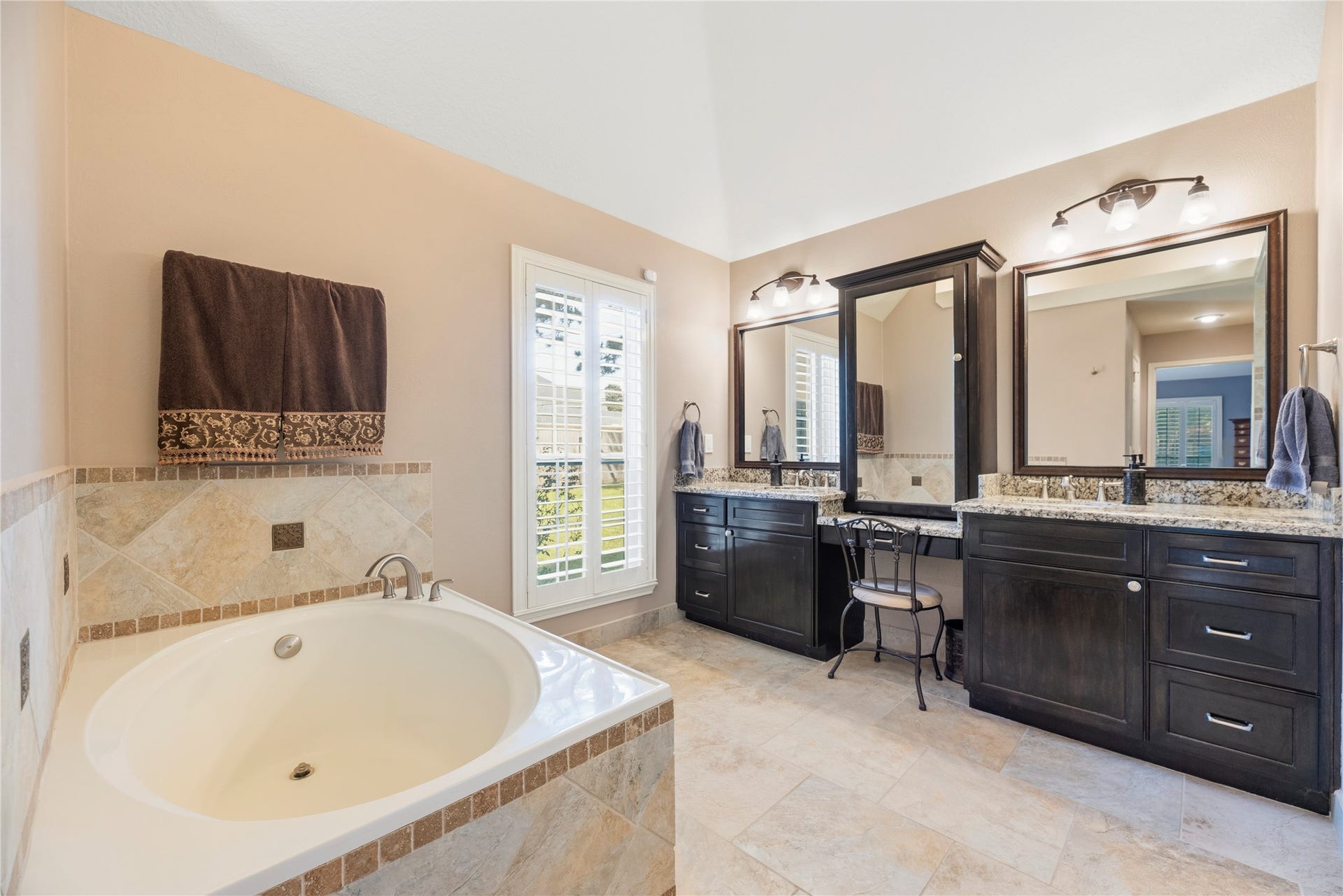 17906 Lone River Court, Houston, TX 77095 Primary bathroom is complete with a dual sink granite vanity, soaking tub and separate shower.
