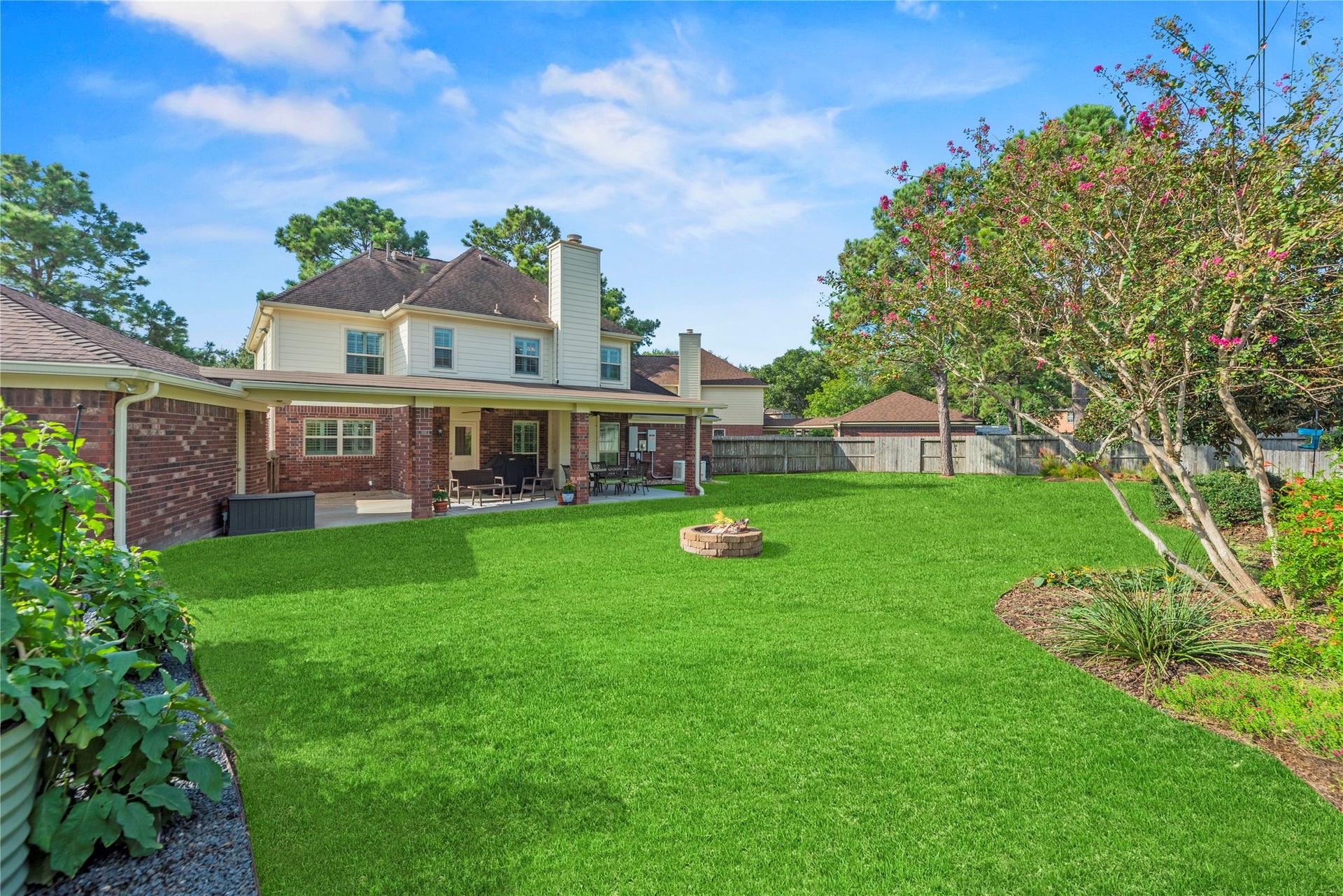 17906 Lone River Court, Houston, TX 77095 Step outside to a private backyard with a covered patio and a fire pit.