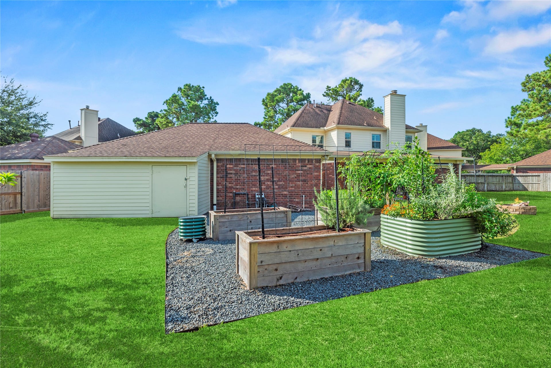 17906 Lone River Court, Houston, TX 77095 Dedicated gardening area with raised planting beds, perfect for growing fresh vegetables, herbs and flowers.