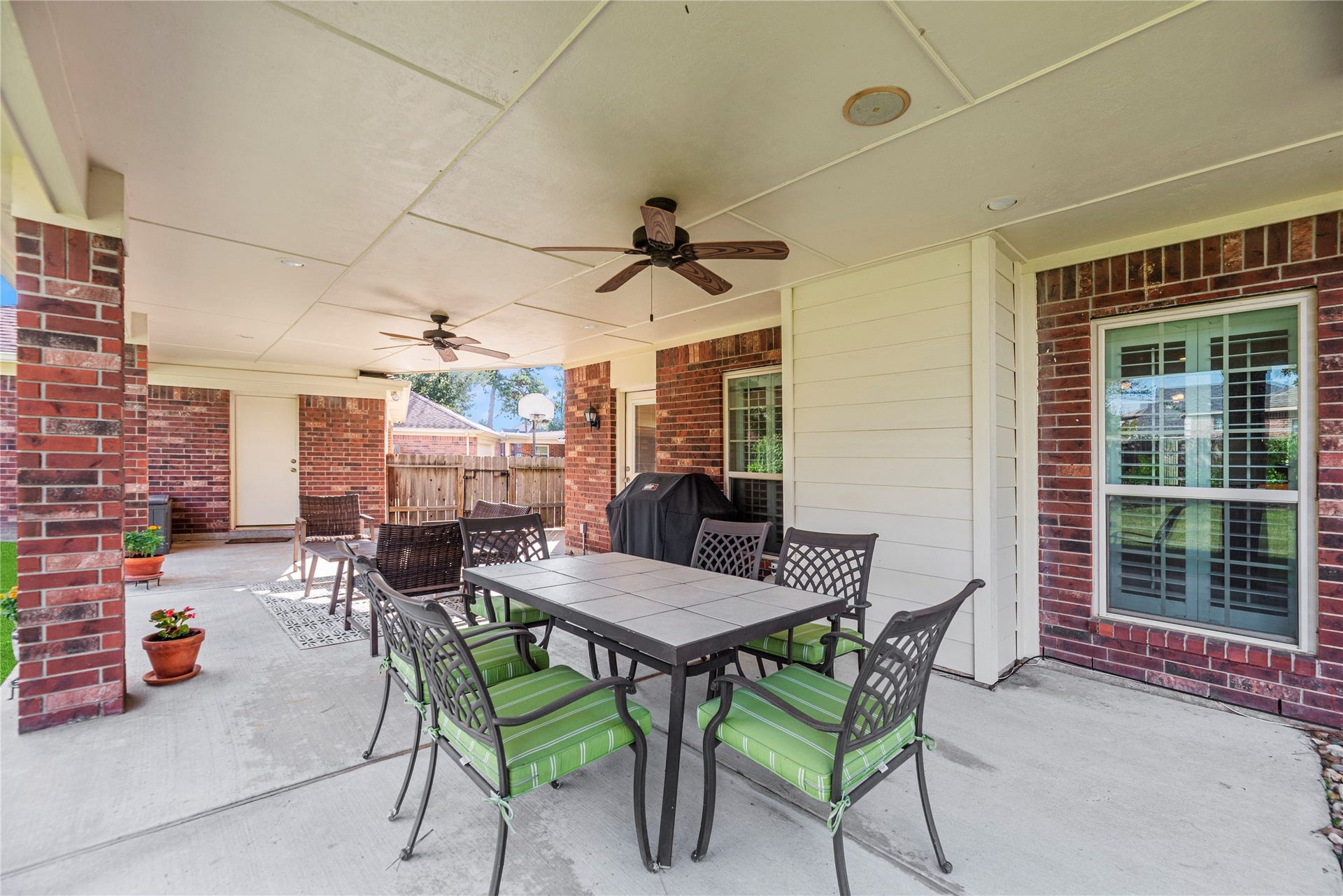 17906 Lone River Court, Houston, TX 77095 Expansive covered patio with ceiling fans.