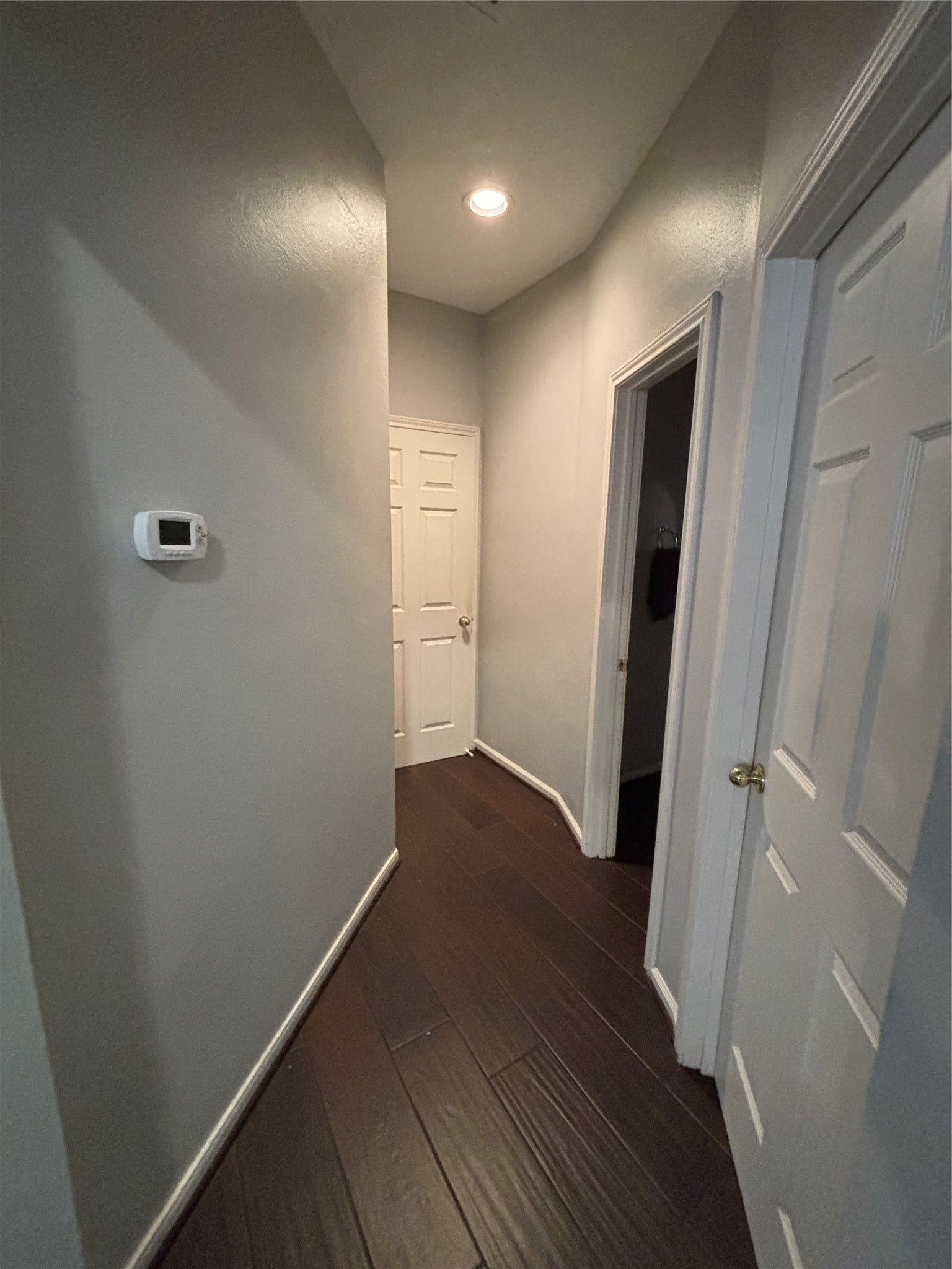 15806 Laurel Cove, Tomball, TX 77377 The hallway leading to the laundry room & garage features the same durable wood-grain tile flooring found throughout the home