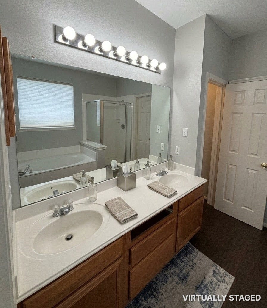 15806 Laurel Cove, Tomball, TX 77377 Primary ensuite bath has "His & Her" sinks