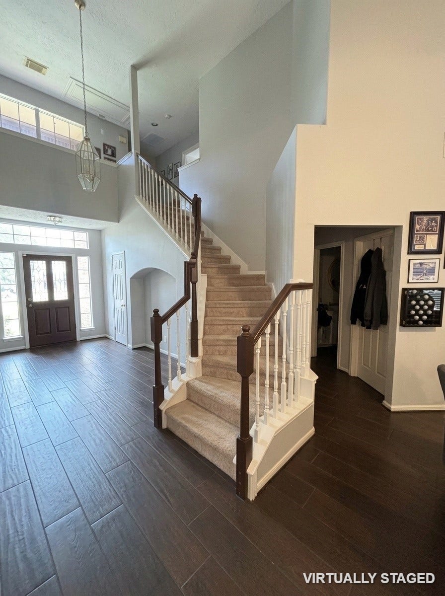 15806 Laurel Cove, Tomball, TX 77377 High ceilings, recent Neutral paint throughout, staircase with railings expertly color-matched to the beautiful flooring