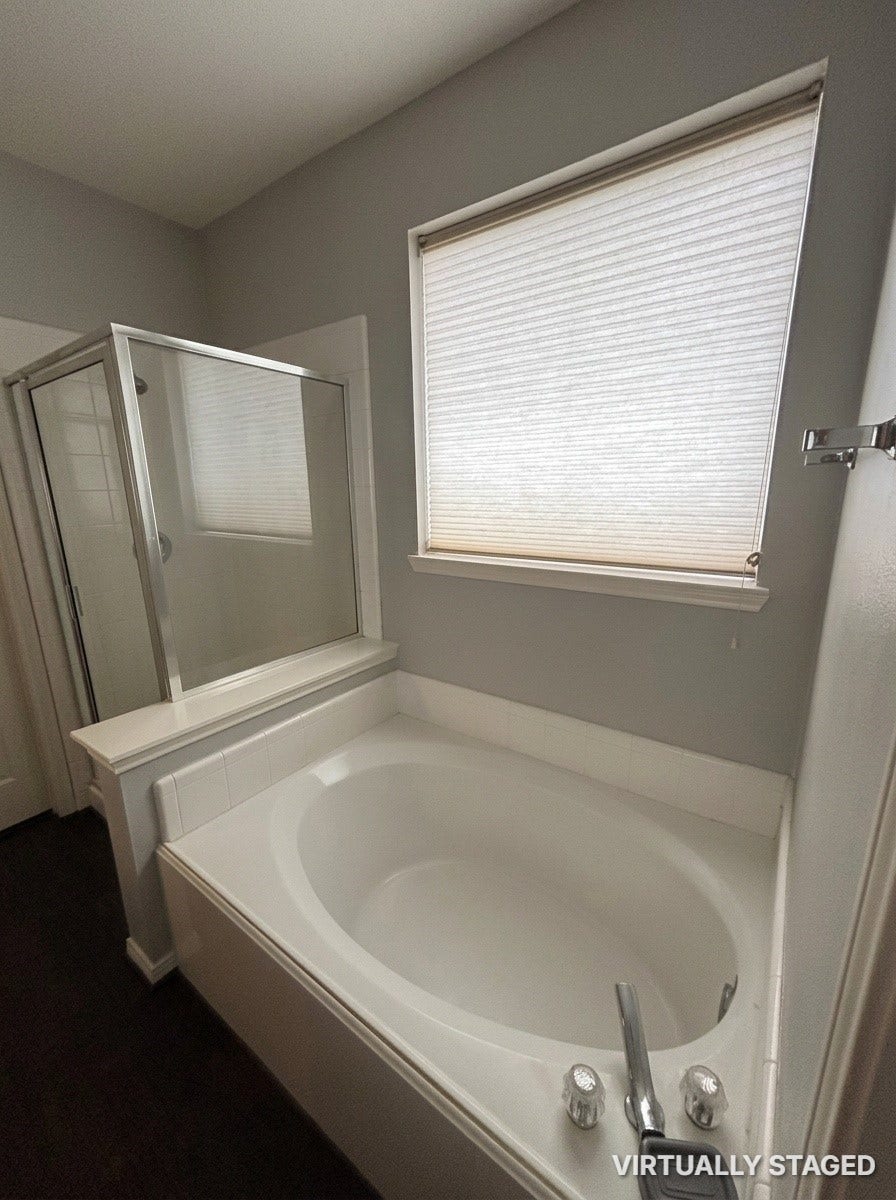 15806 Laurel Cove, Tomball, TX 77377 Primary ensuite bathroom featuring a relaxing garden soaking tub & separate shower