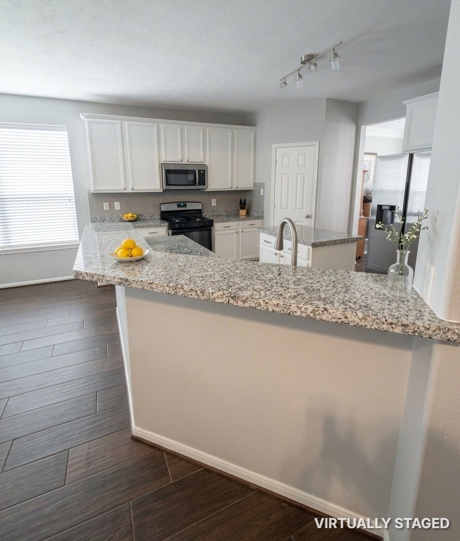 15806 Laurel Cove, Tomball, TX 77377 Open kitchen features granite countertops, white cabinets, a large center island and a walk-in pantry plus awesome breakfast bar!