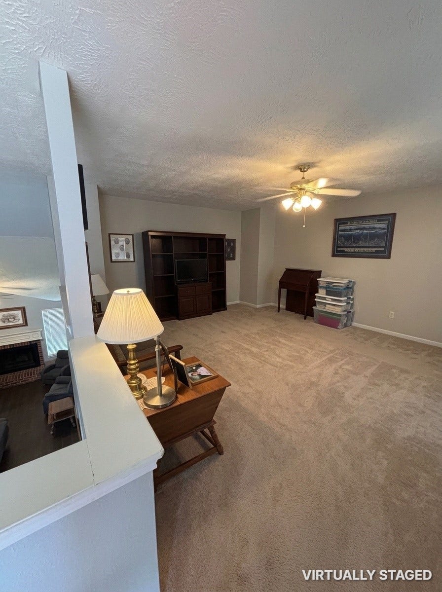 15806 Laurel Cove, Tomball, TX 77377 Spacious game room features a large Entertainment center that conveys with the property