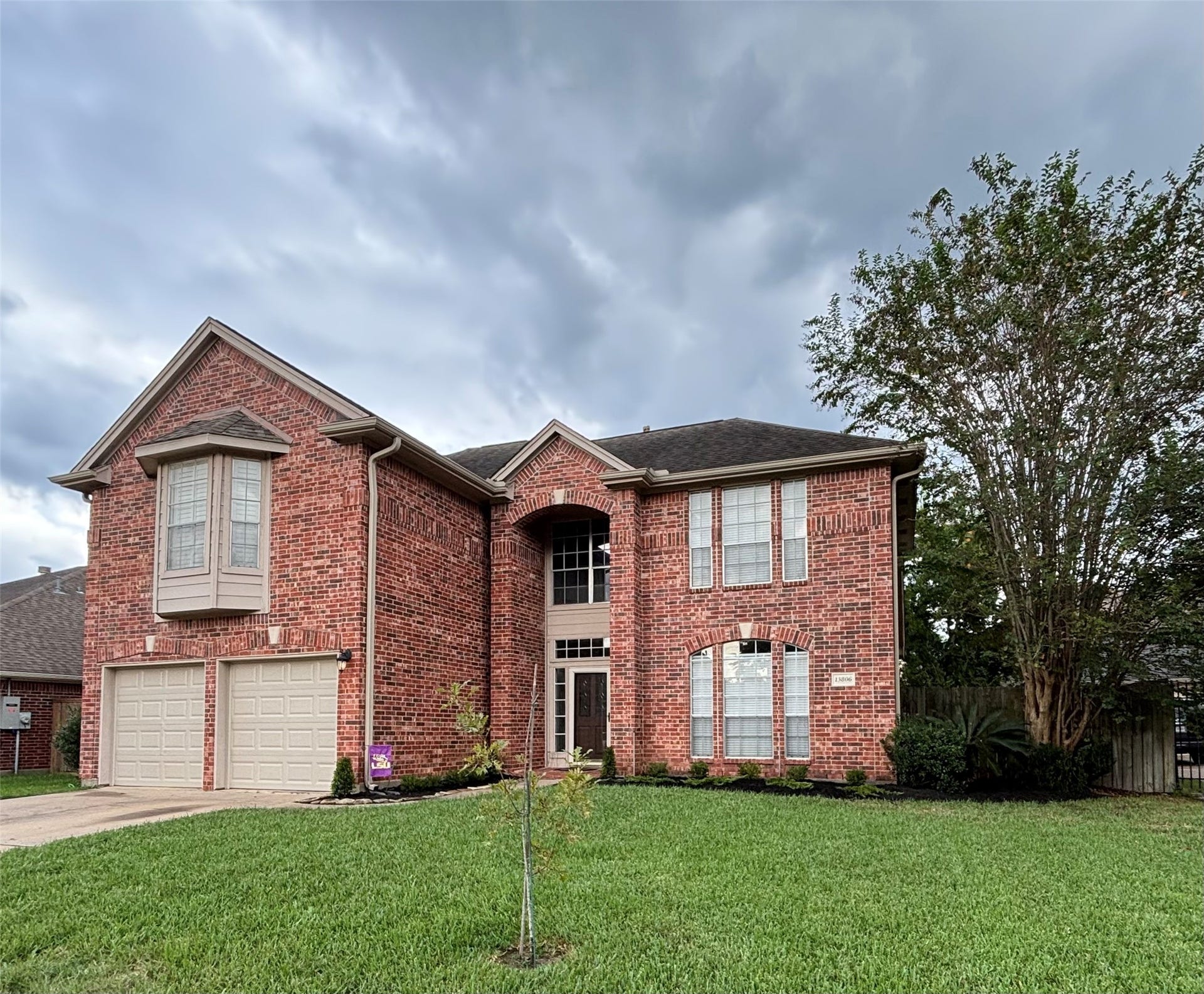 15806 Laurel Cove, Tomball, TX 77377 Four-sided brick exterior with new garage doors