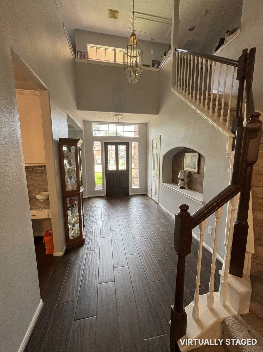 15806 Laurel Cove, Tomball, TX 77377 Beautiful wood-grain tile flooring flows seamlessly throughout the main living areas! Plus recent Neutral paint throughout