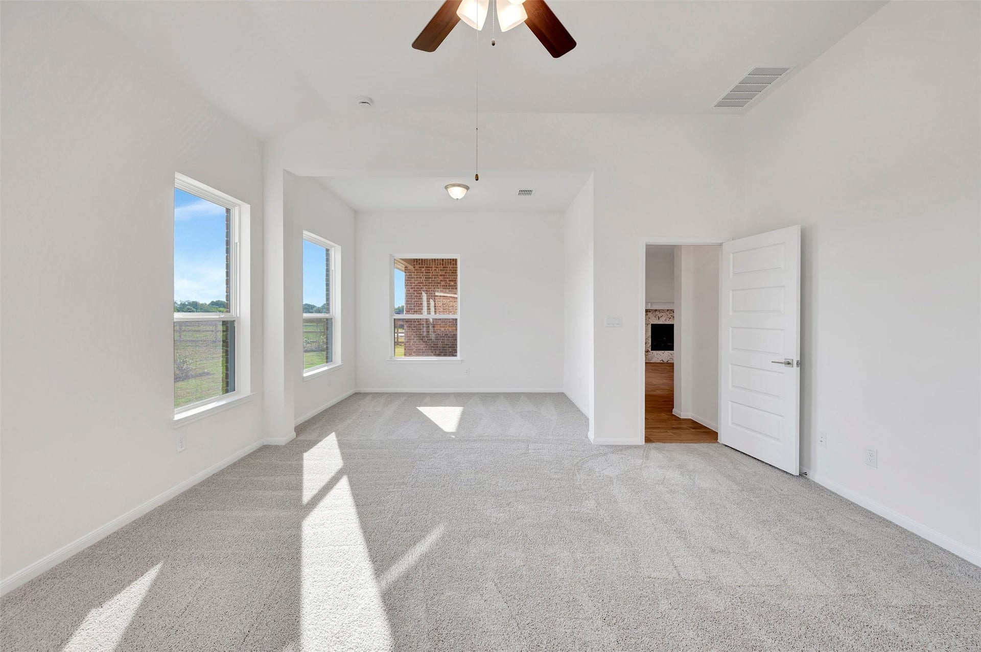 Tranquil primary suite with sitting area