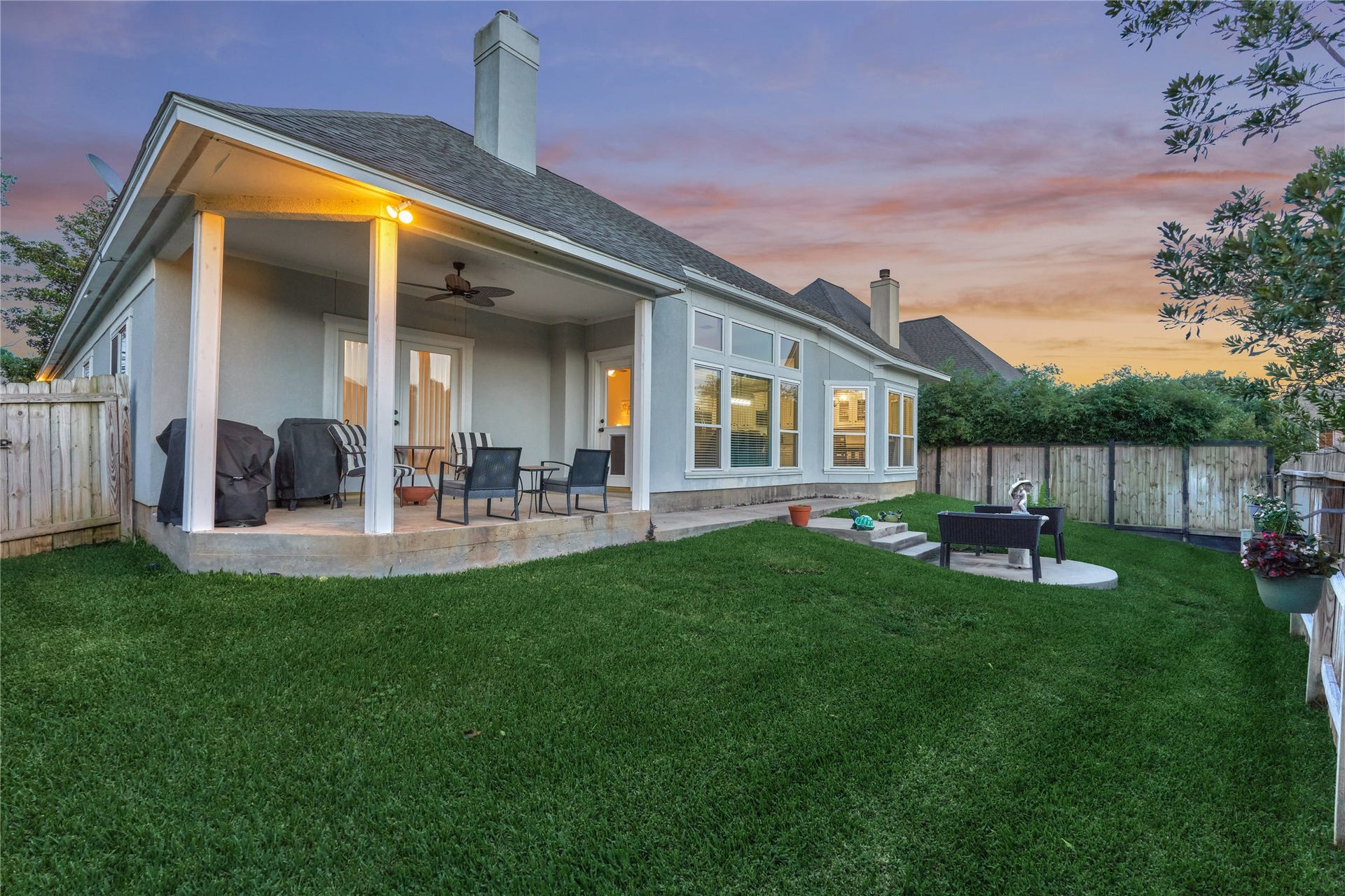15 Newberry Court, Montgomery, TX 77356 Inviting backyard with a covered patio, perfect for entertaining and comfortable outdoor living.