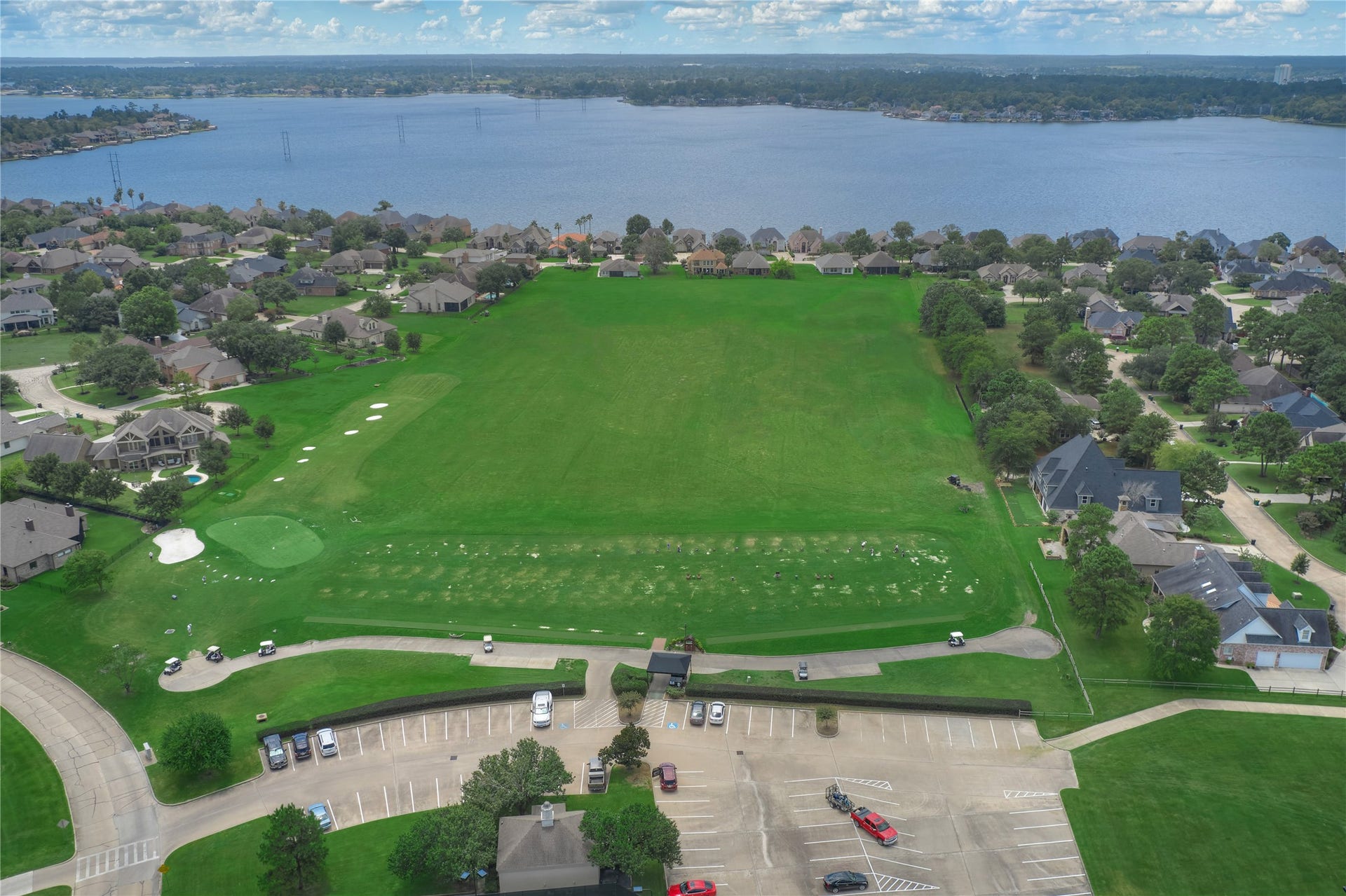 15 Newberry Court, Montgomery, TX 77356 A beautifully maintained driving range, ideal for golf enthusiasts seeking the perfect place to practice and refine their swing.