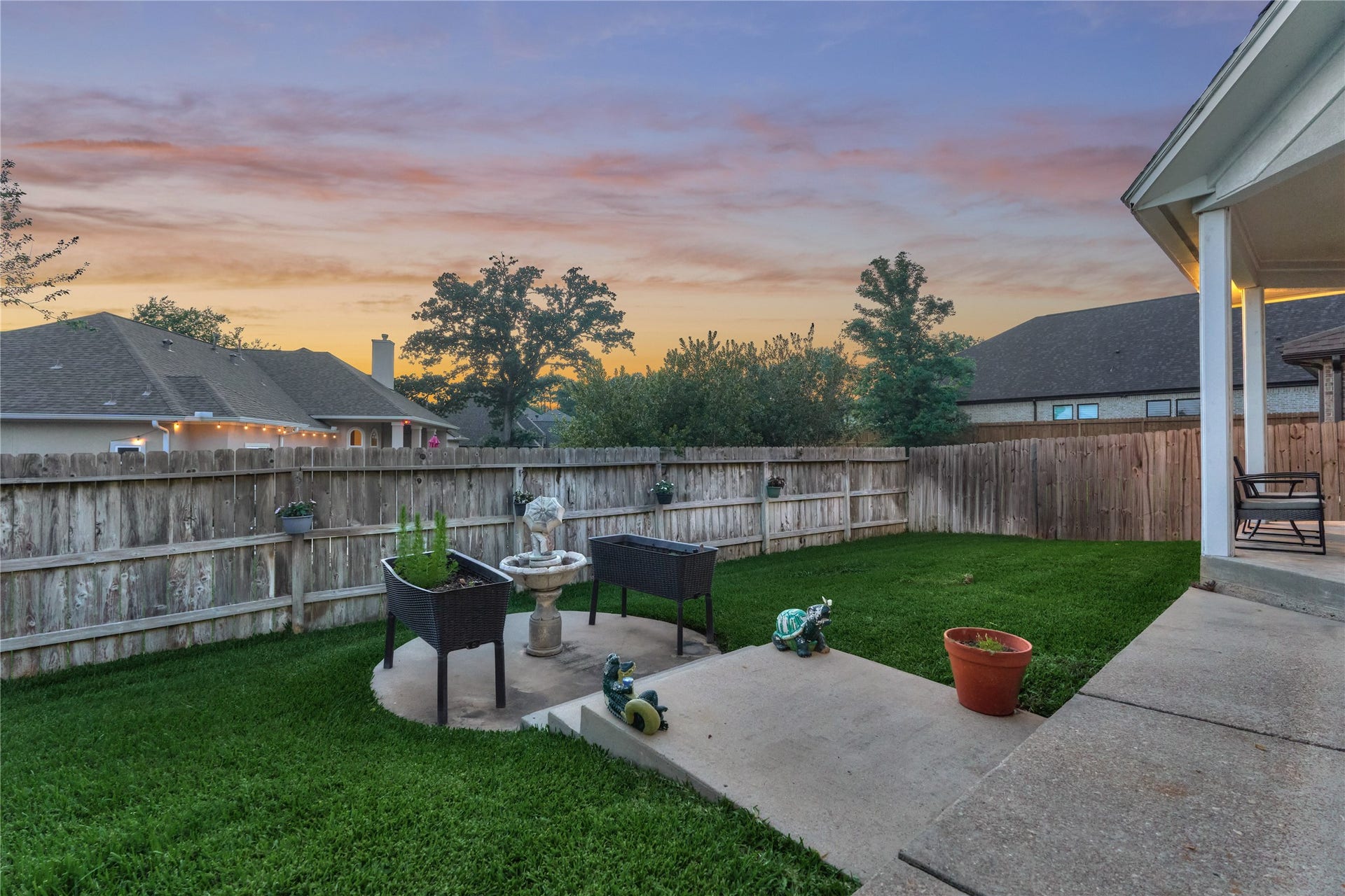 15 Newberry Court, Montgomery, TX 77356 Versatile patio space ideal for outdoor entertaining, whether arranged as a comfortable sitting area, a grilling station, or a firepit gathering spot.