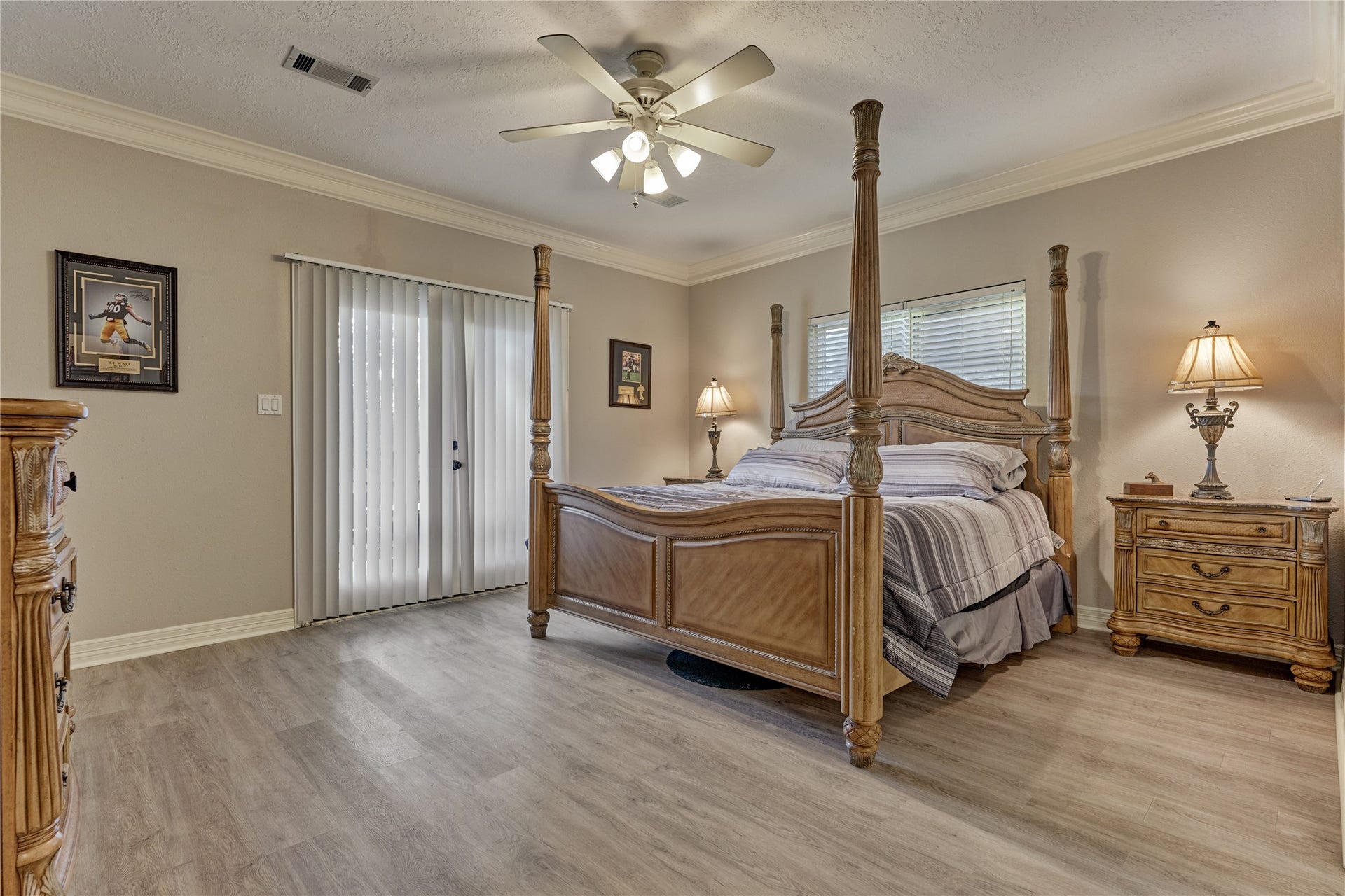 15 Newberry Court, Montgomery, TX 77356 Owners retreat showcases updated flooring, a huge walk-in closet, and offers direct access to the patio and backyard through elegant French doors,