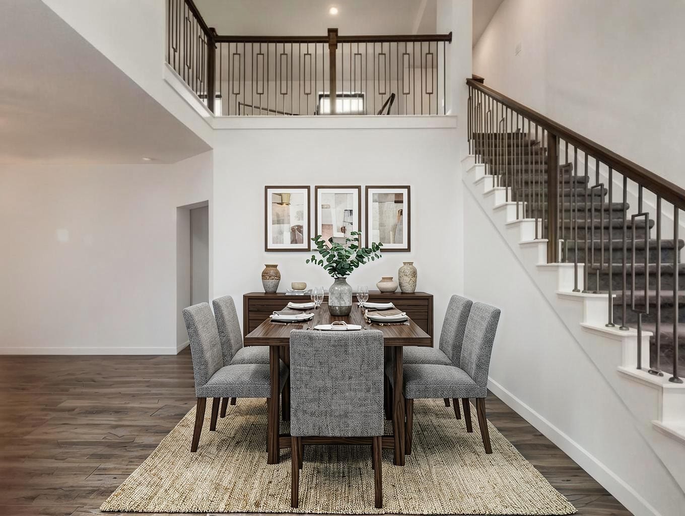 13021 Sapphire Lake Lane, La Marque, TX 77568 The dining area is framed by the staircase and open living layout, giving it a strong sense of place. It feels elegant without being overdone. Virtually staged.