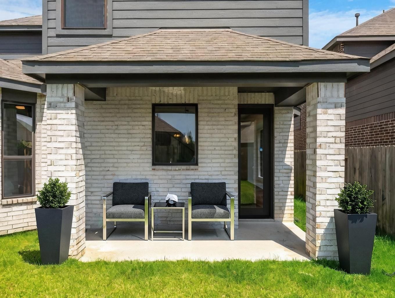 13021 Sapphire Lake Lane, La Marque, TX 77568 The covered patio creates a quiet outdoor extension just off the back of the home. A simple, shaded space for lounging, dining, or evening air. Virtually staged.