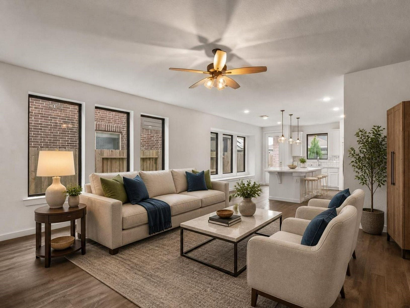 13021 Sapphire Lake Lane, La Marque, TX 77568 This view captures the living rooms scale, soft staging, and easy connection to the dining and kitchen areas. A calm, refined main gathering space. Virtually staged.