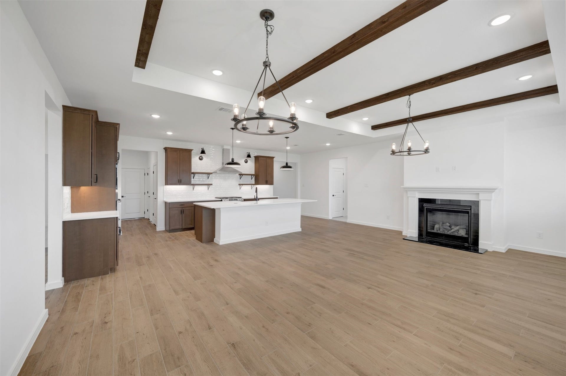 12027 Old Fashion Circle, Mont Belvieu, TX 77535 Impressive living area with decorative stained beams on the ceiling