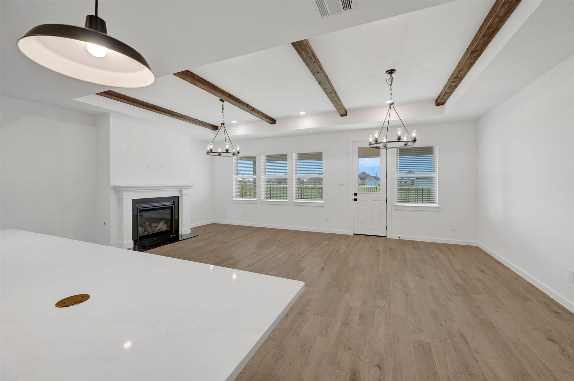 12027 Old Fashion Circle, Mont Belvieu, TX 77535 Kitchen overlooks the great room and dining area