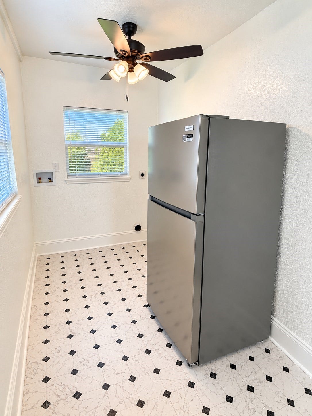 109 N Avenue A Avenue, Freeport, TX 77541 Kitchen features a brand-new refrigerator and conveniently located washer and dryer hookups for added functionality