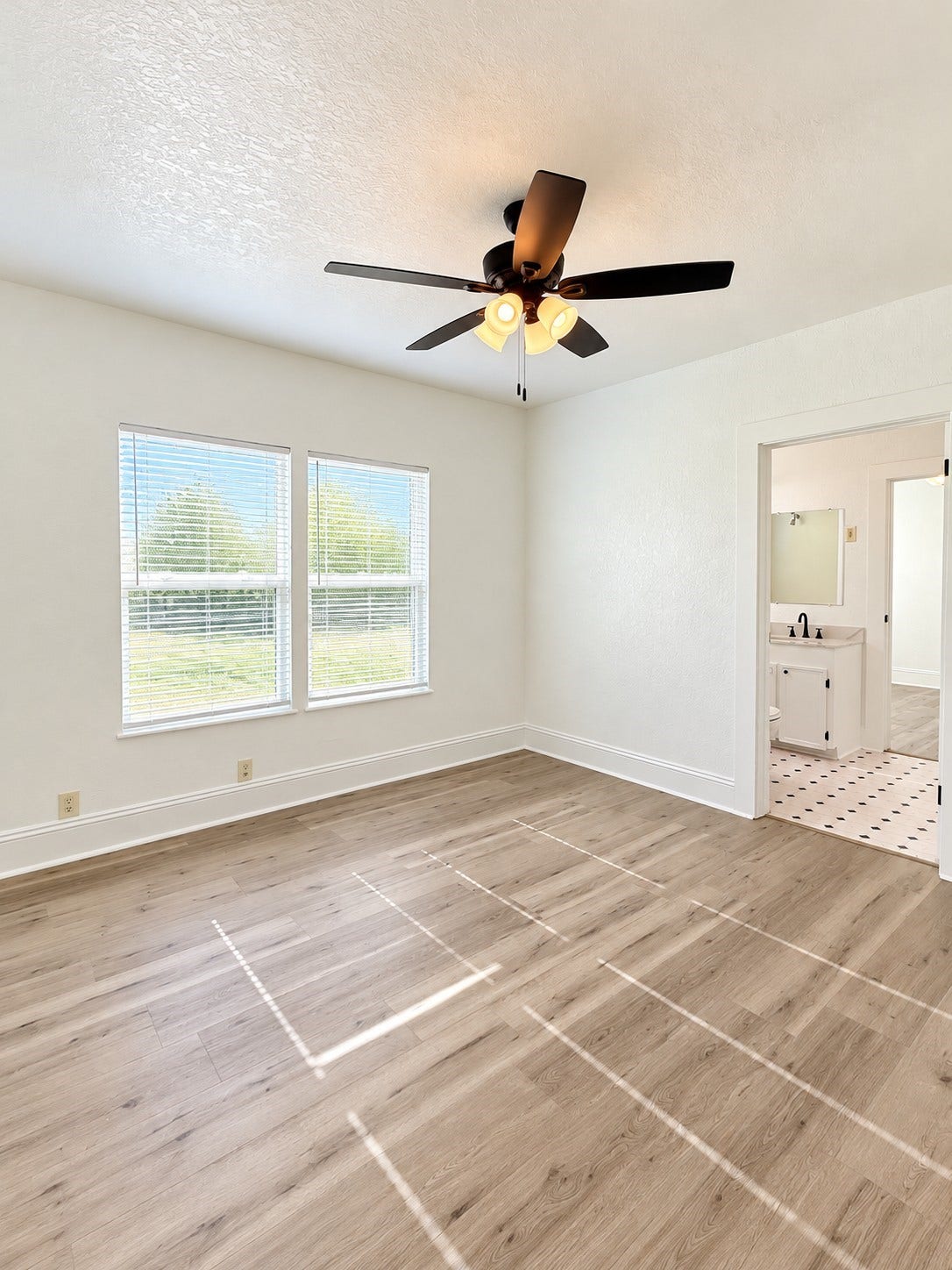 109 N Avenue A Avenue, Freeport, TX 77541 Bedroom 1 features beautiful natural lighting, creating a bright and inviting atmosphere