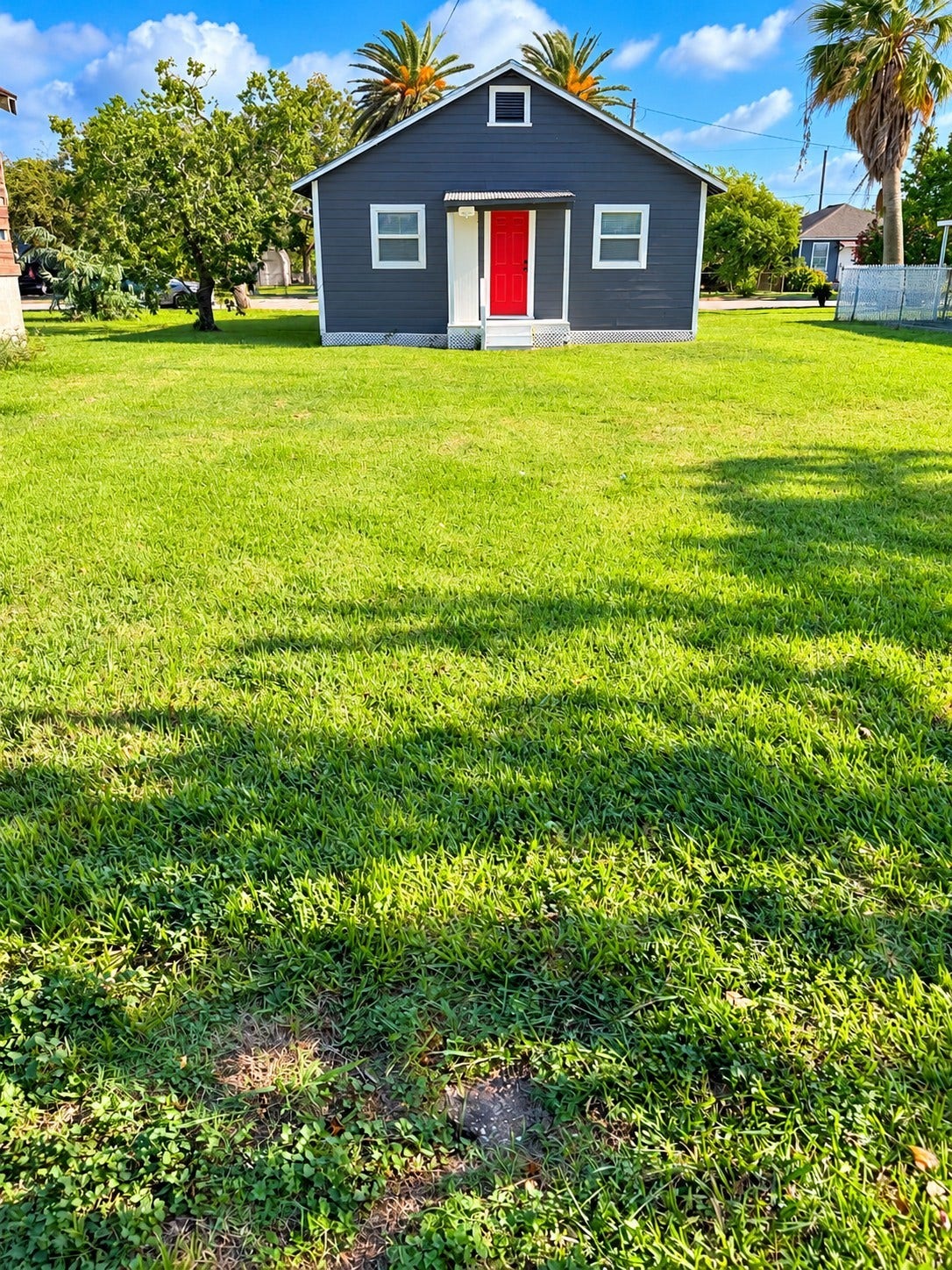 109 N Avenue A Avenue, Freeport, TX 77541 Spacious backyard offering endless possibilities for outdoor entertaining, family gatherings, or simply relaxing and enjoying the outdoors