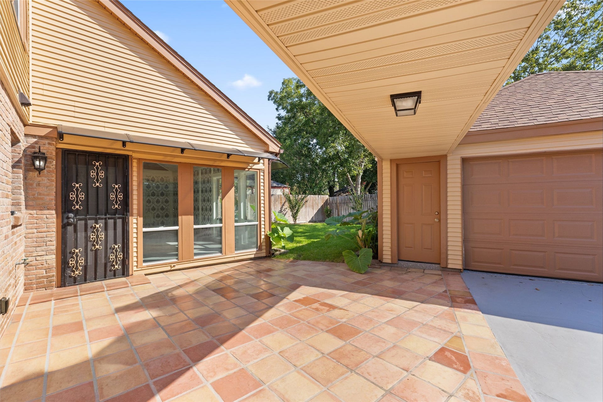 Gated detached garage and backyard