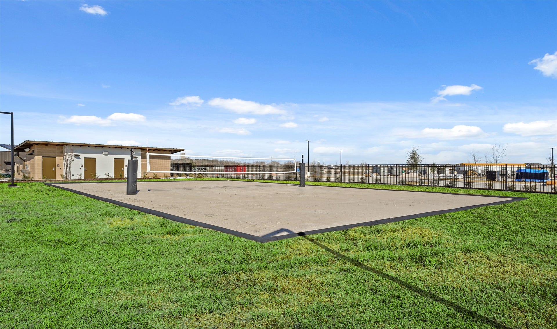 655 Daniels Lake Lane, Dayton, TX 77535 Outdoor volleyball court with a scenic backdrop.